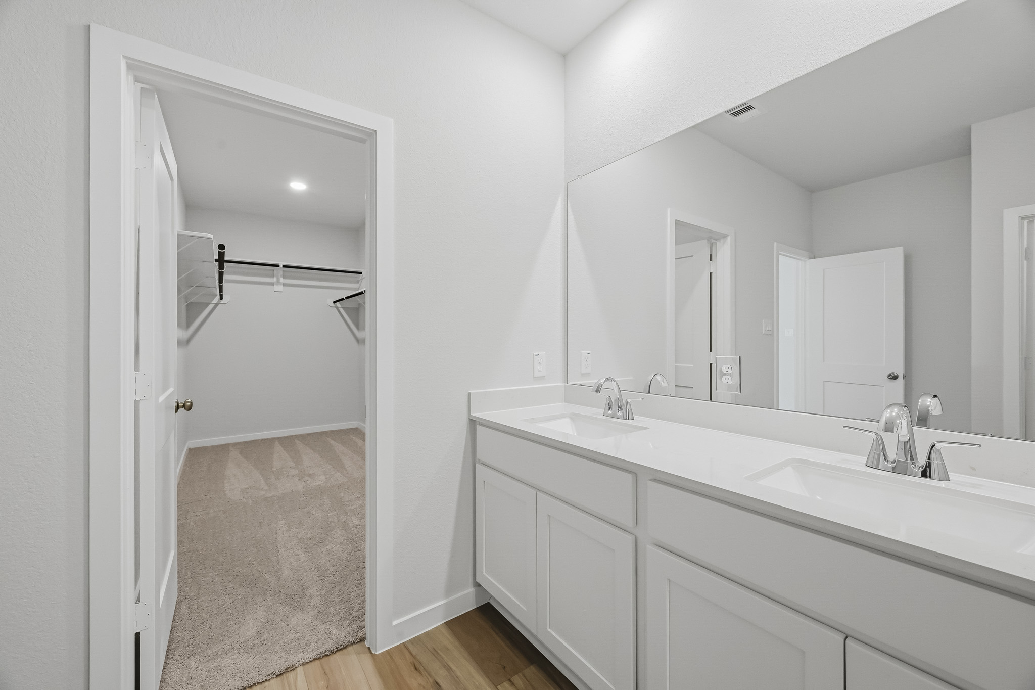 A bathroom with a shower and sink.
