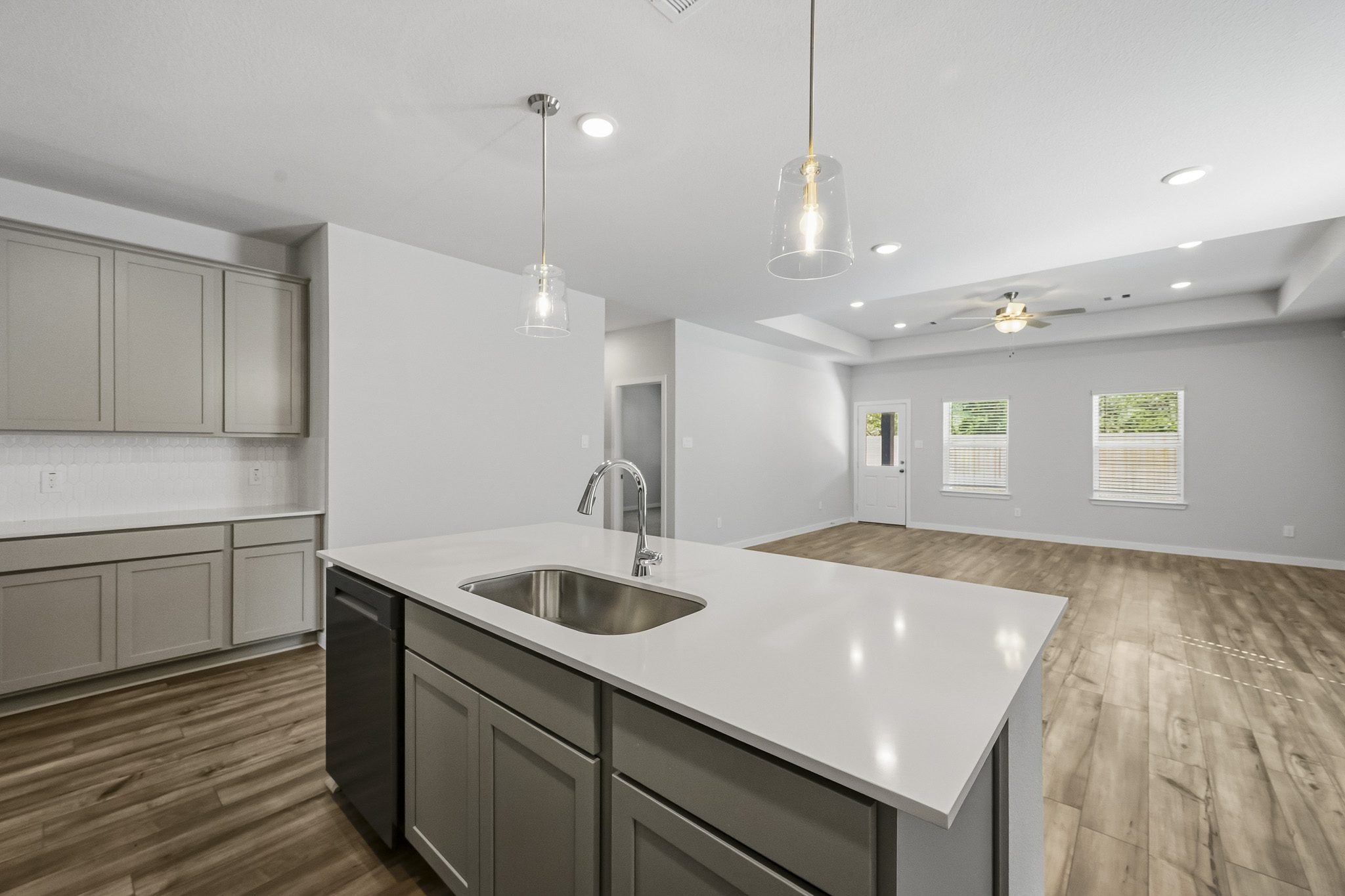 A kitchen with a marble countertop.