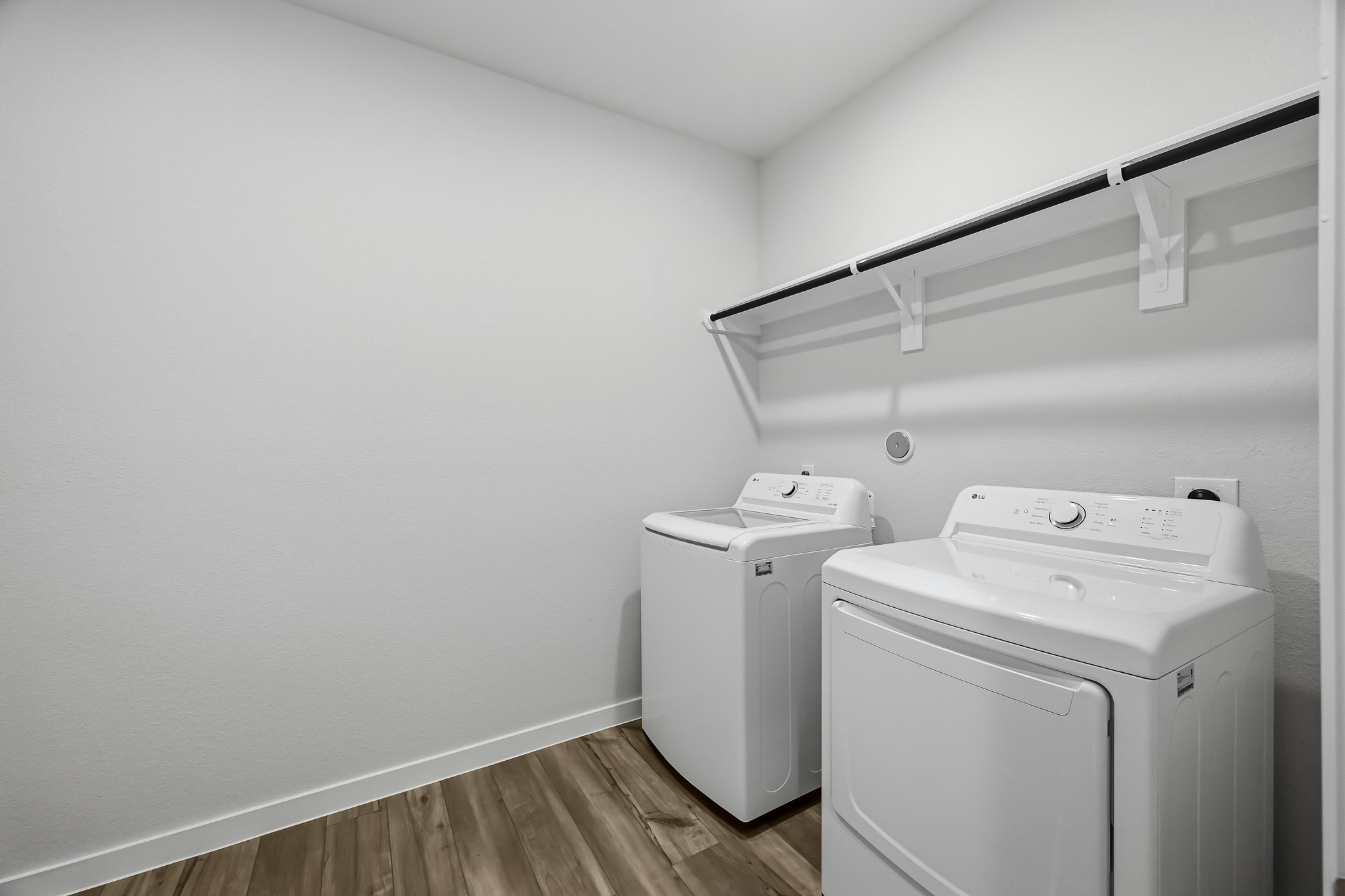 A room with a white wall and a white machine.