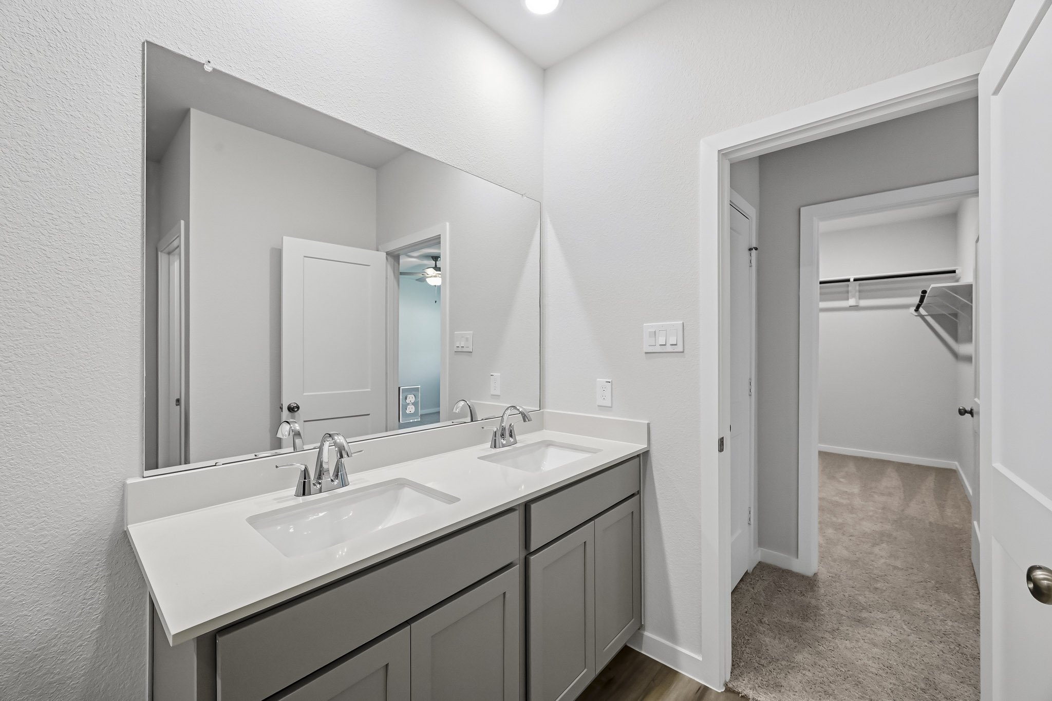 A bathroom with two sinks.