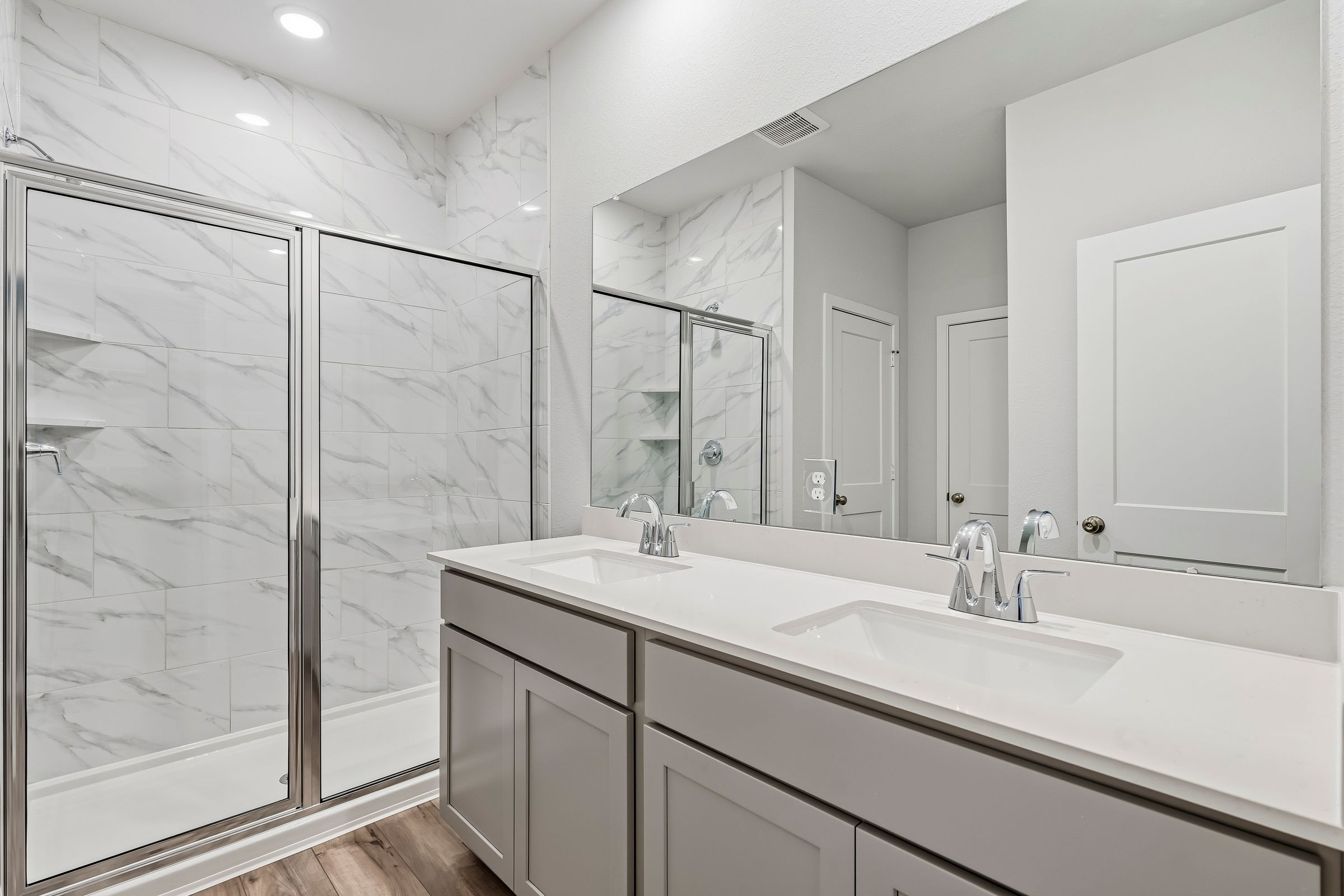 A bathroom with a glass shower.
