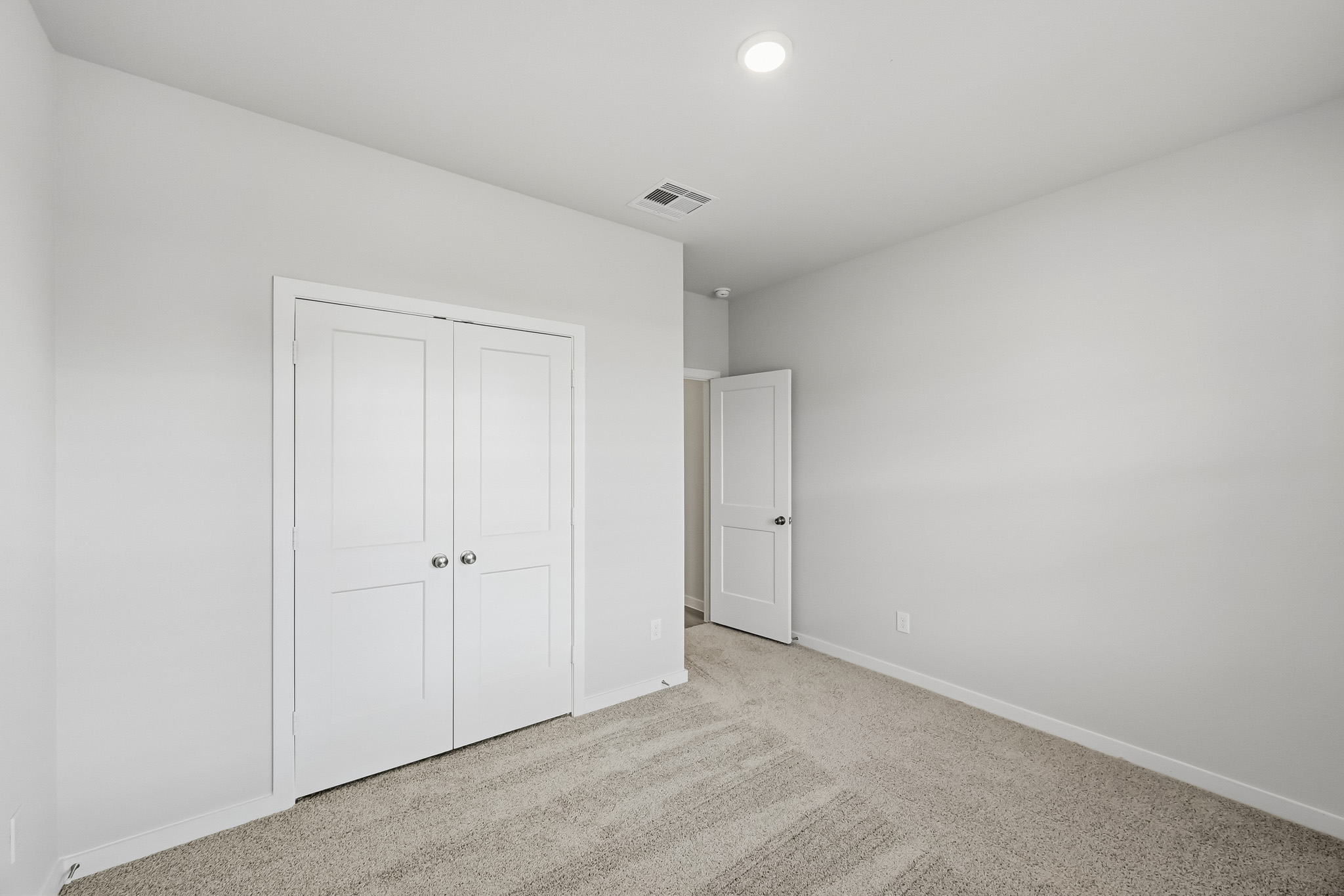 A room with white doors.