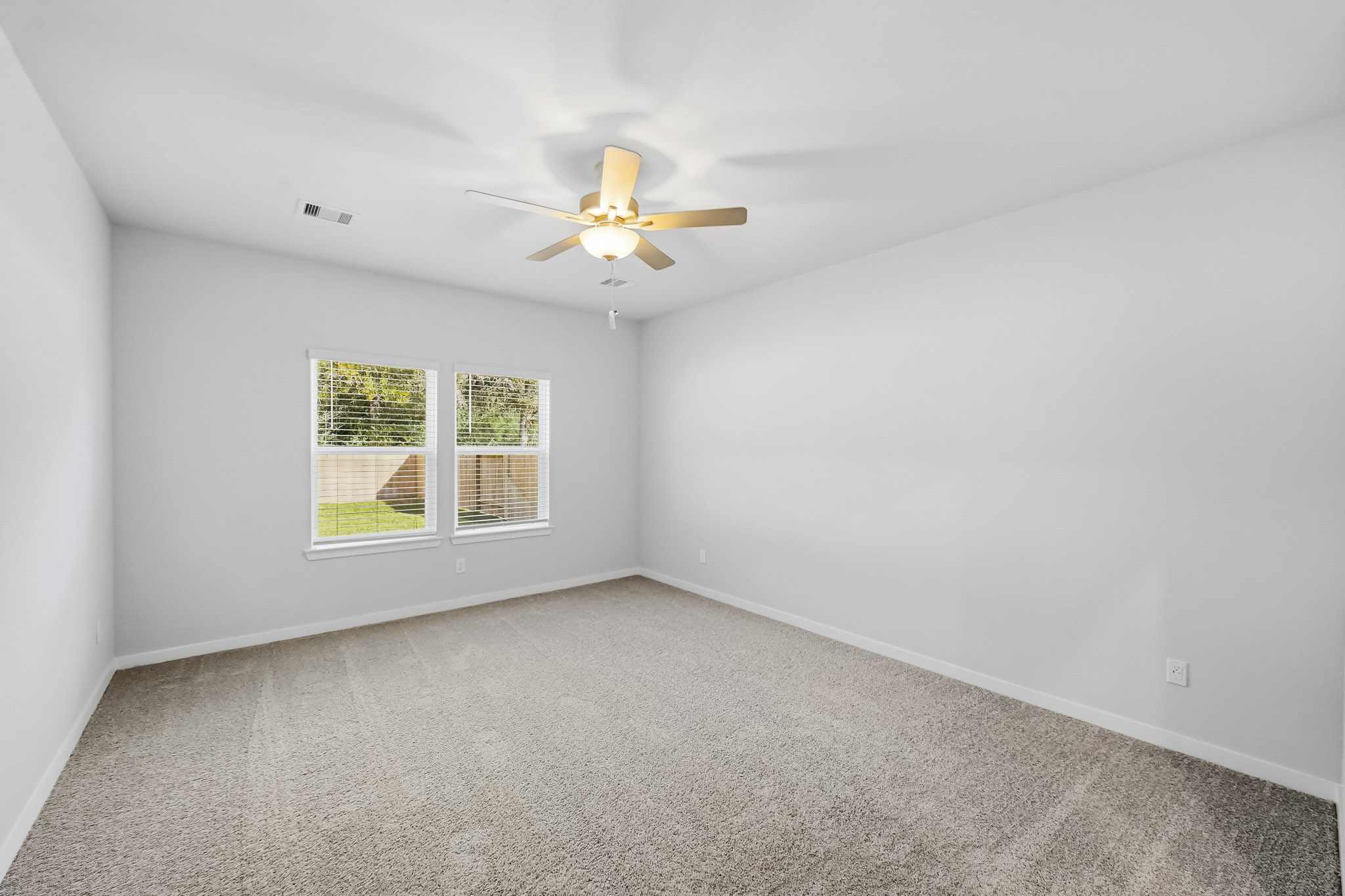 A ceiling fan in a room.