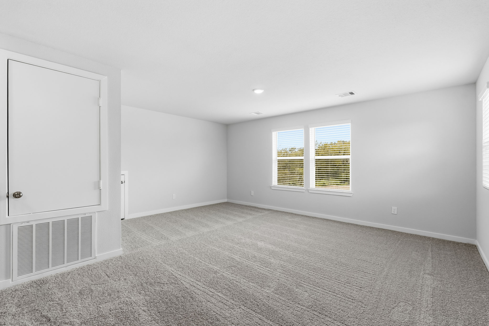 A room with a door and a window.