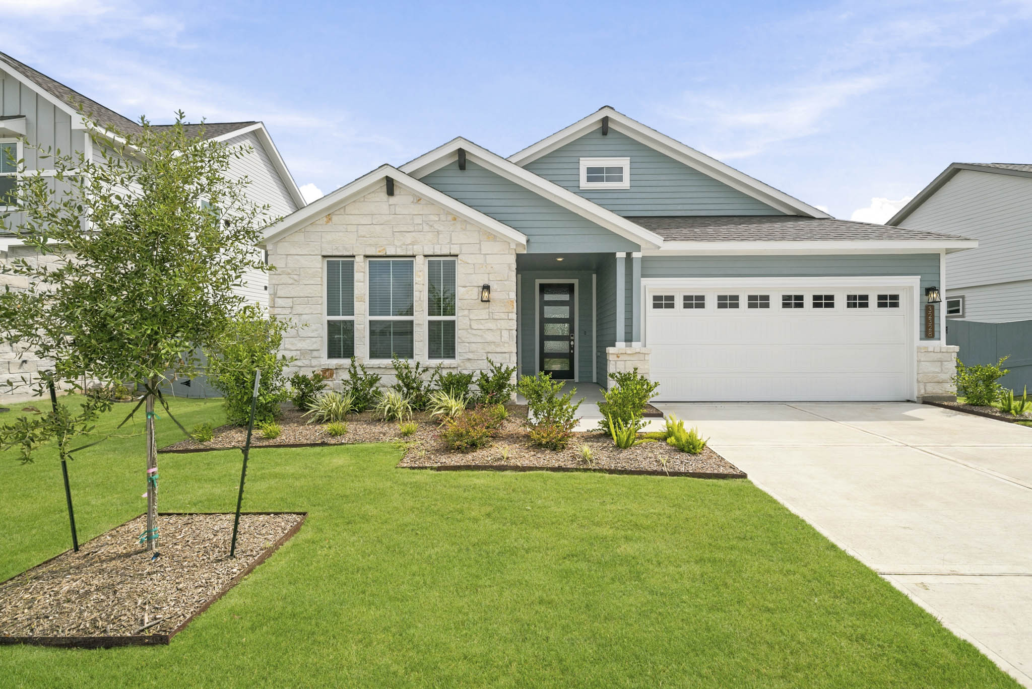 A house with a green lawn.