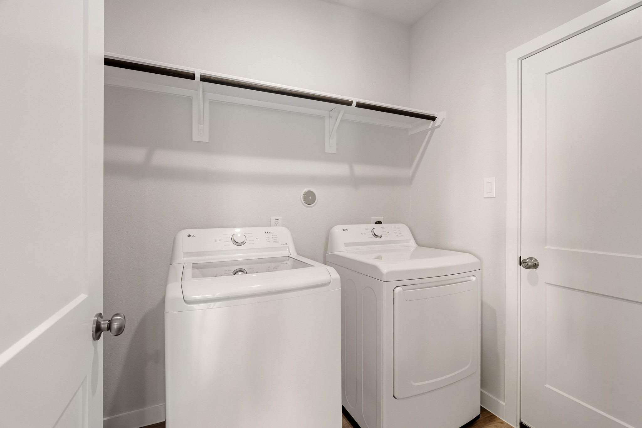 A washer and dryer in a room.