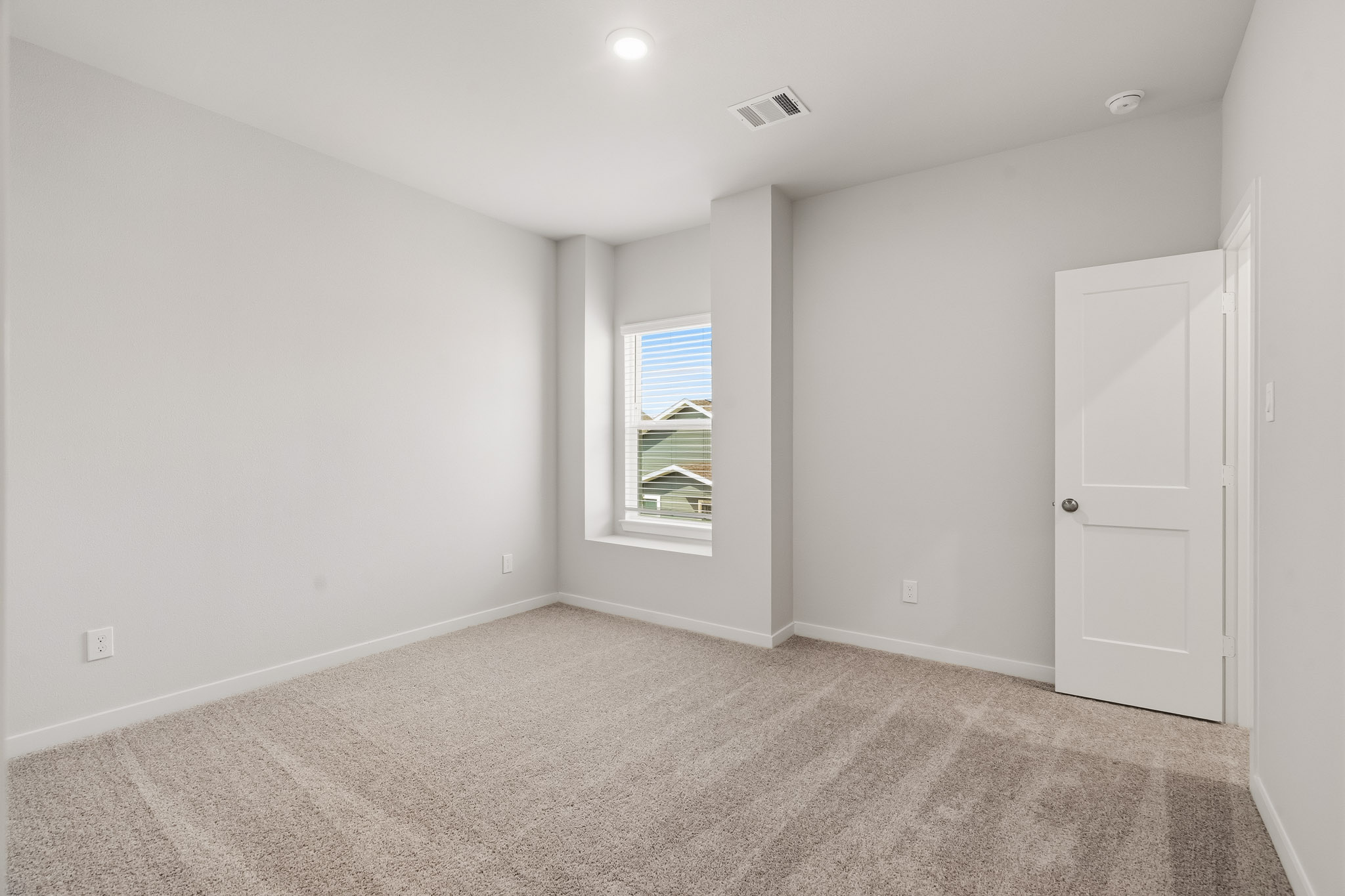 A room with a door and a window.