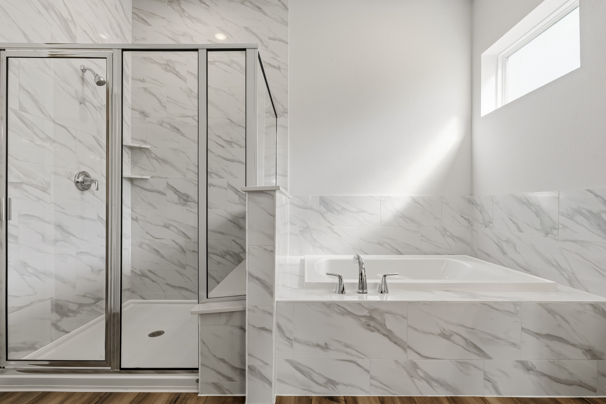A bathroom with a glass shower.