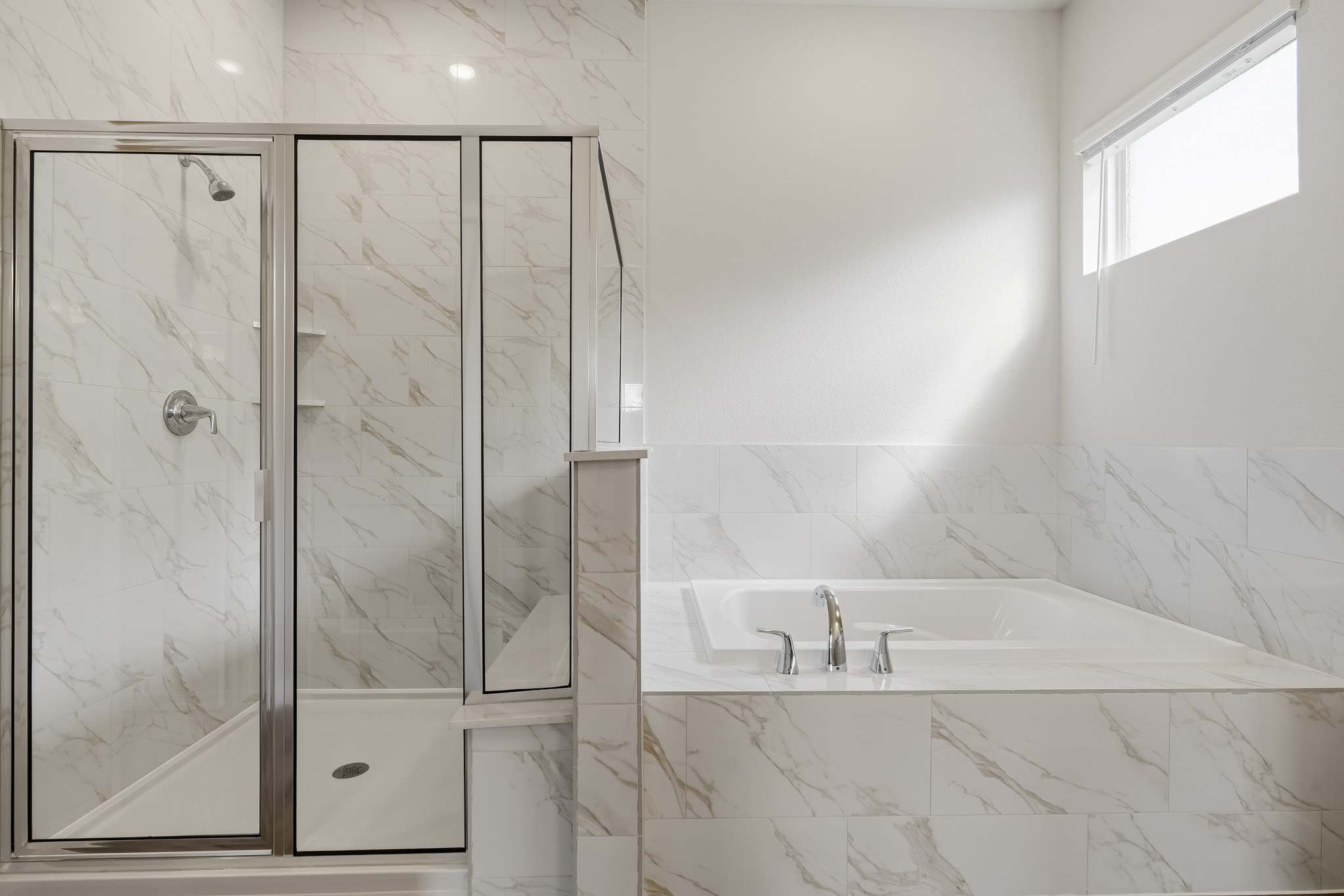 A bathroom with a glass shower.
