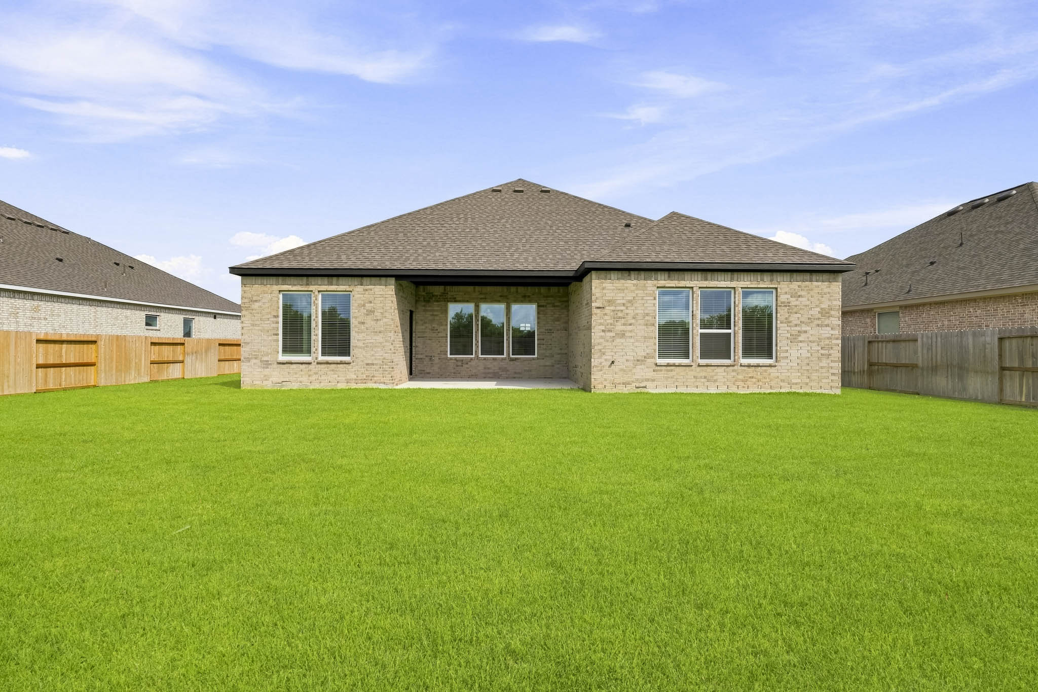 A house with a grass yard.