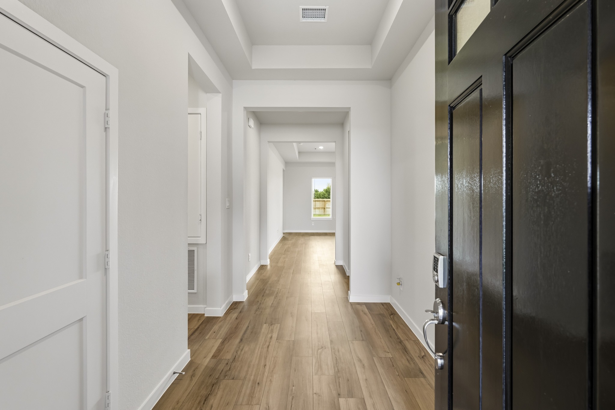 A hallway with white doors.