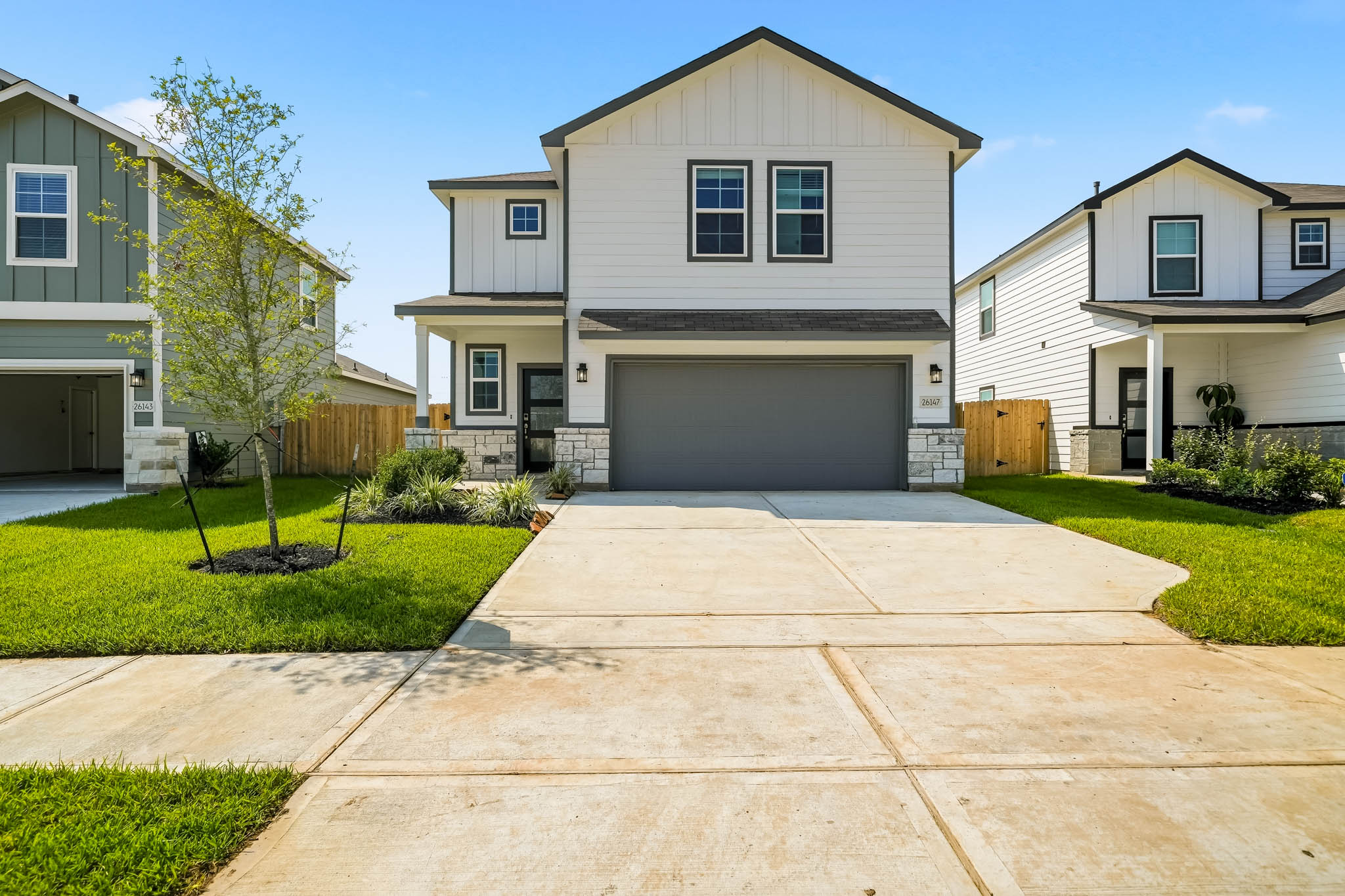 A driveway leading to a house.