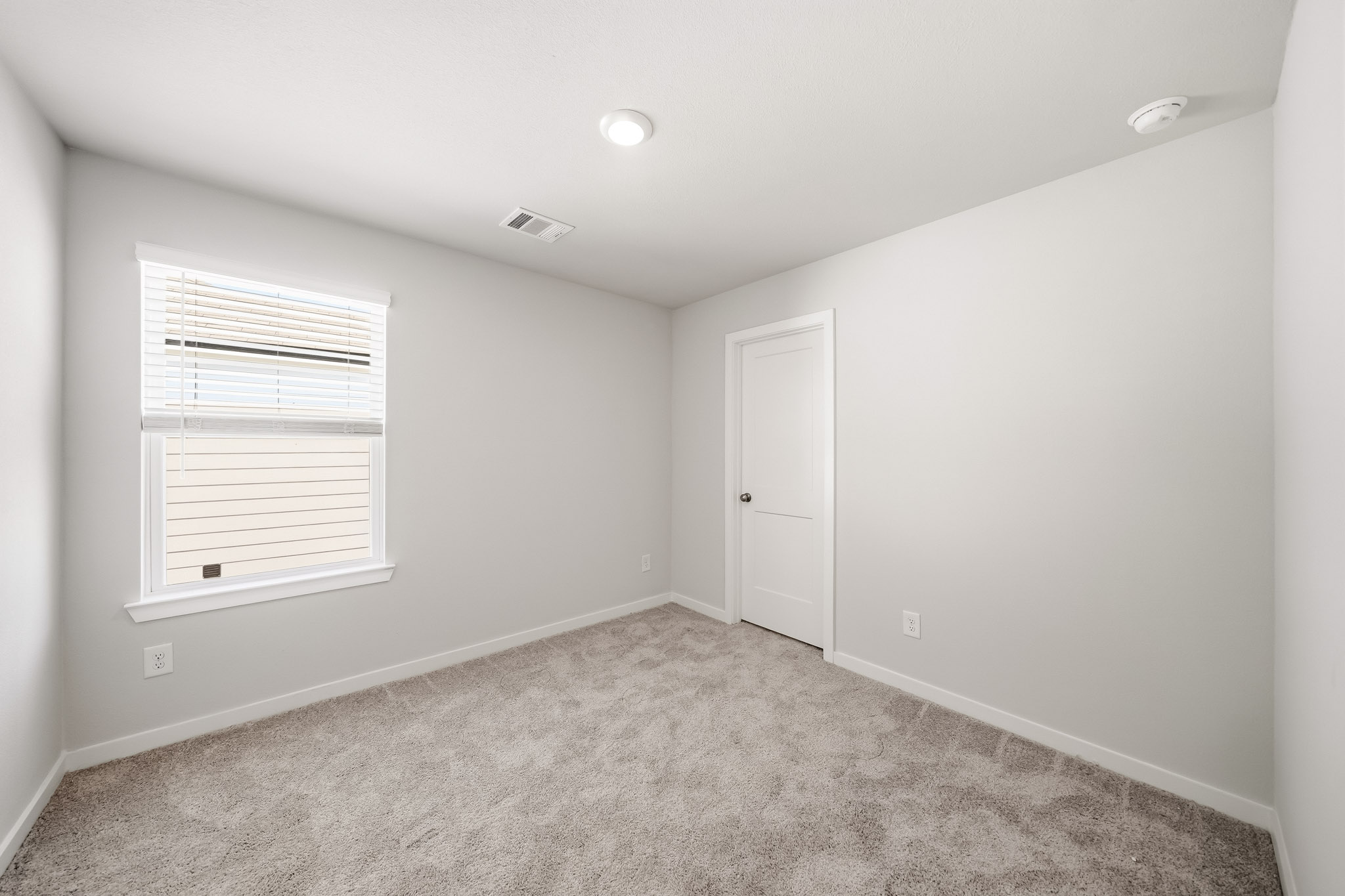 A room with a door and a window.