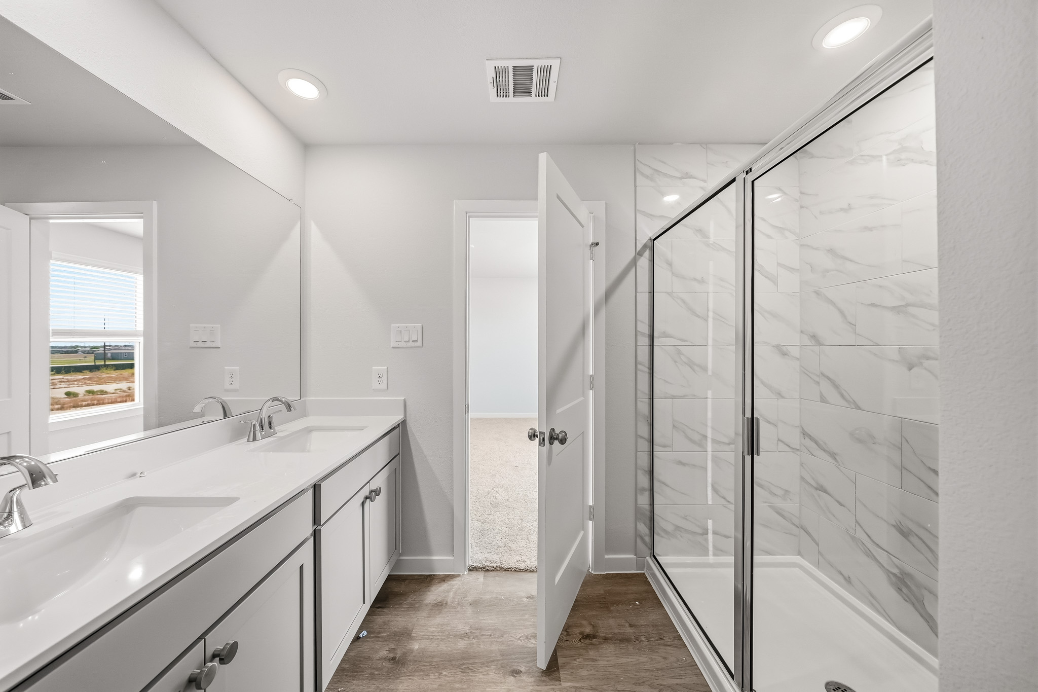 A bathroom with a glass shower.