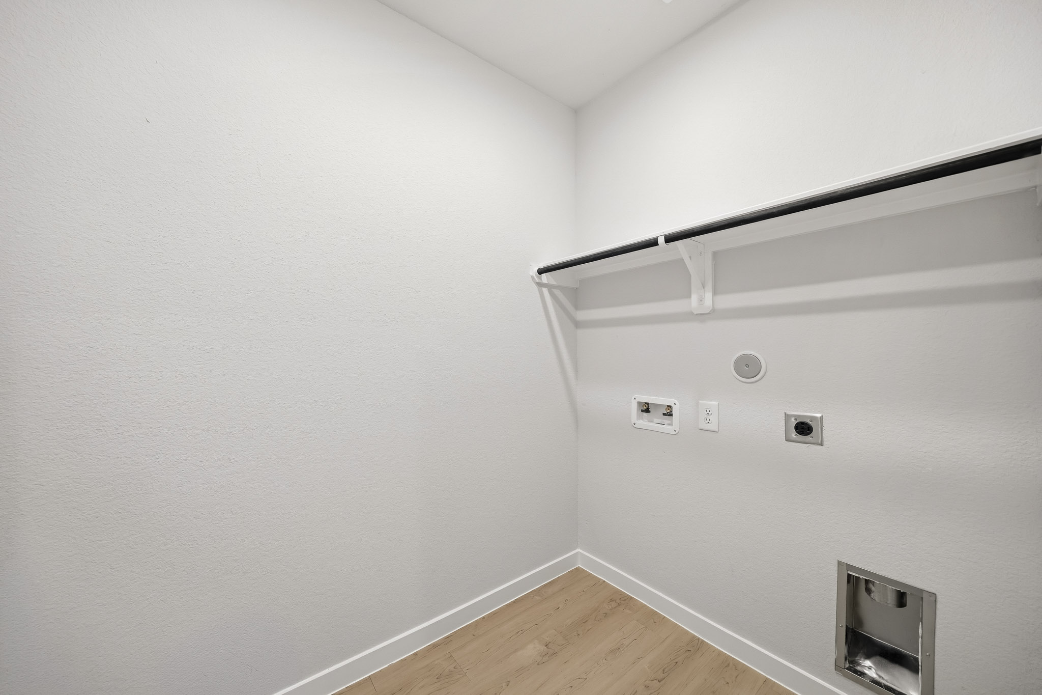 A white wall with a light on it.