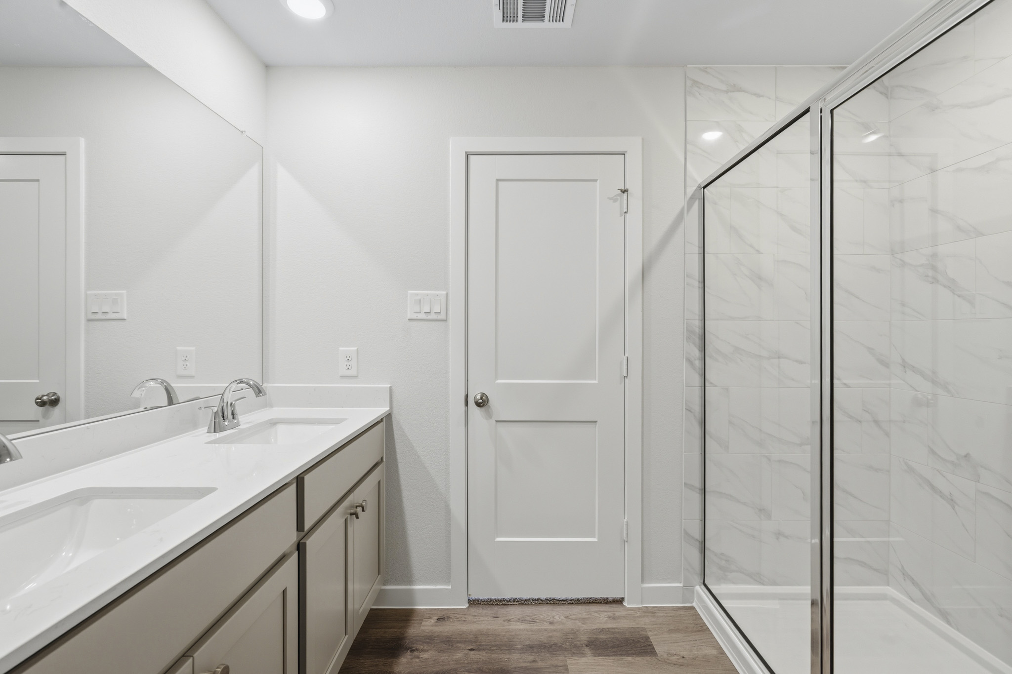 A bathroom with a glass shower.