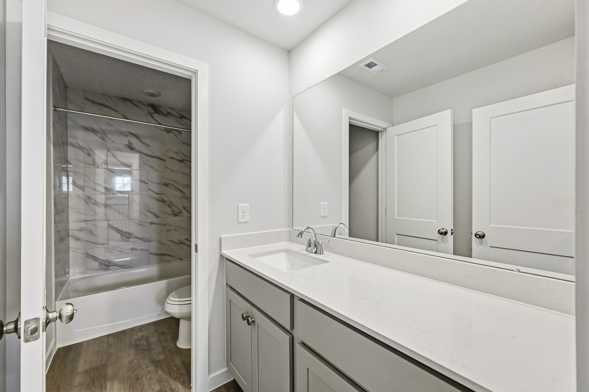 A bathroom with a glass shower.