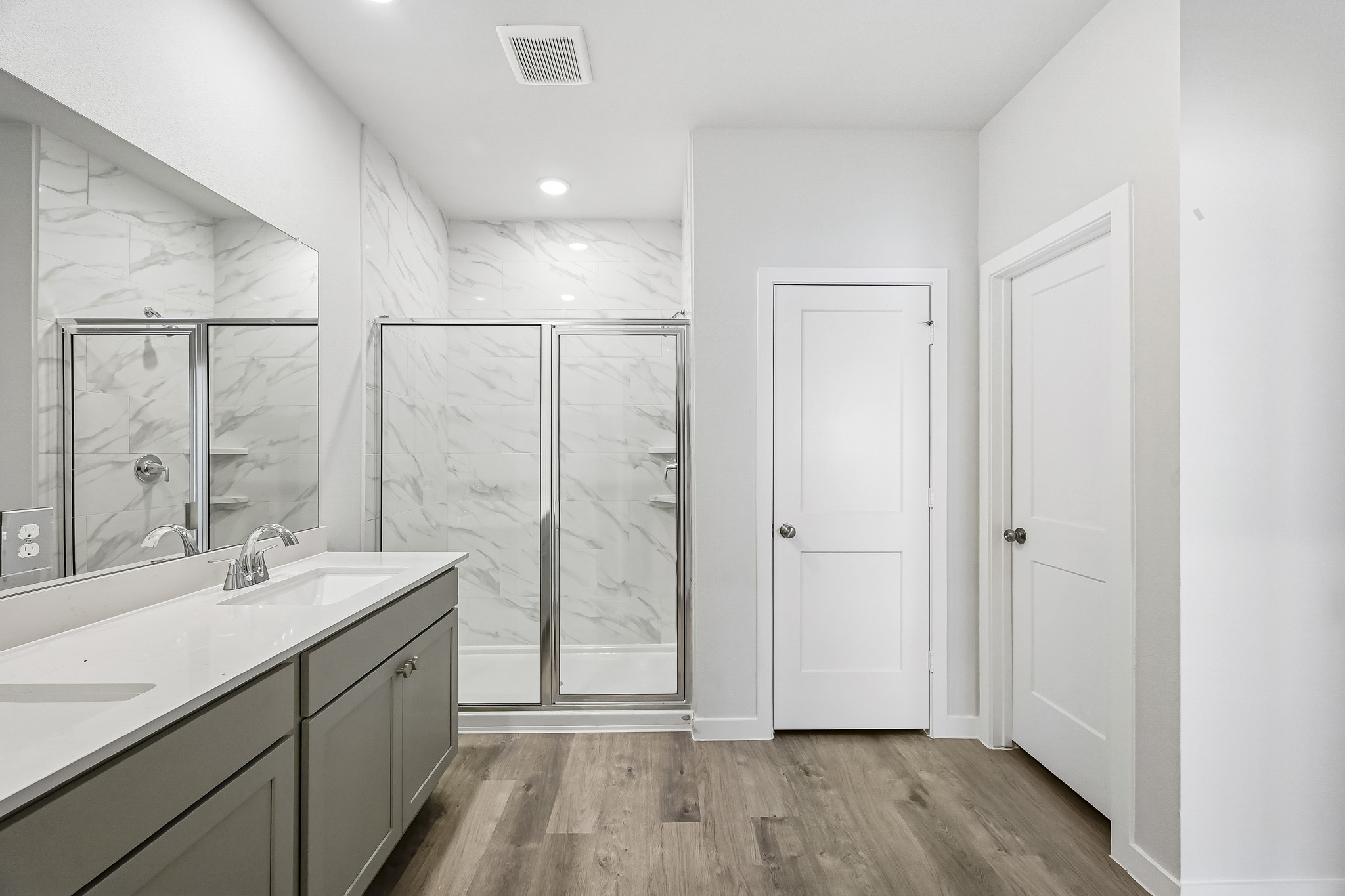 A bathroom with a glass shower.