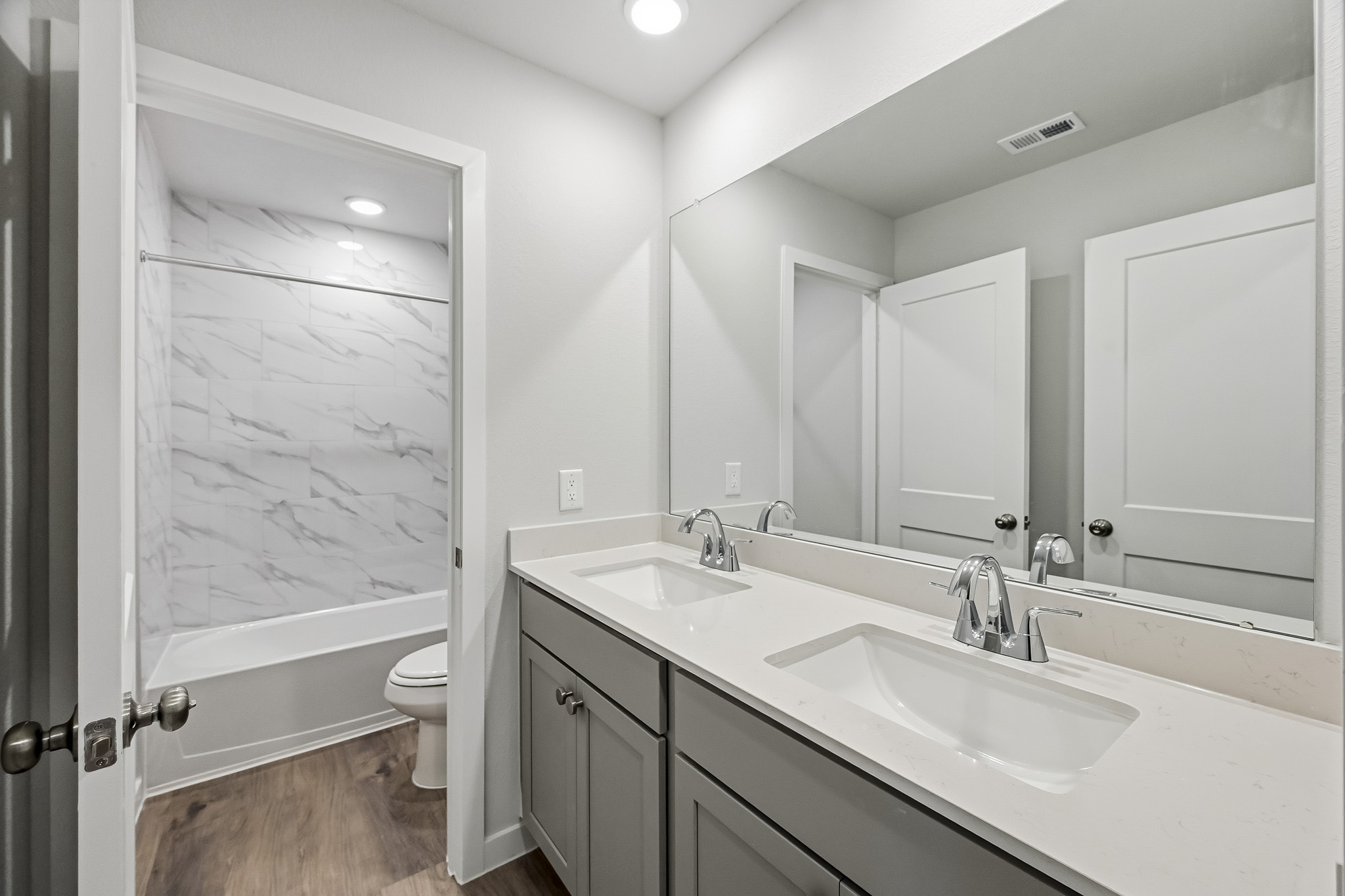 A bathroom with a glass shower.