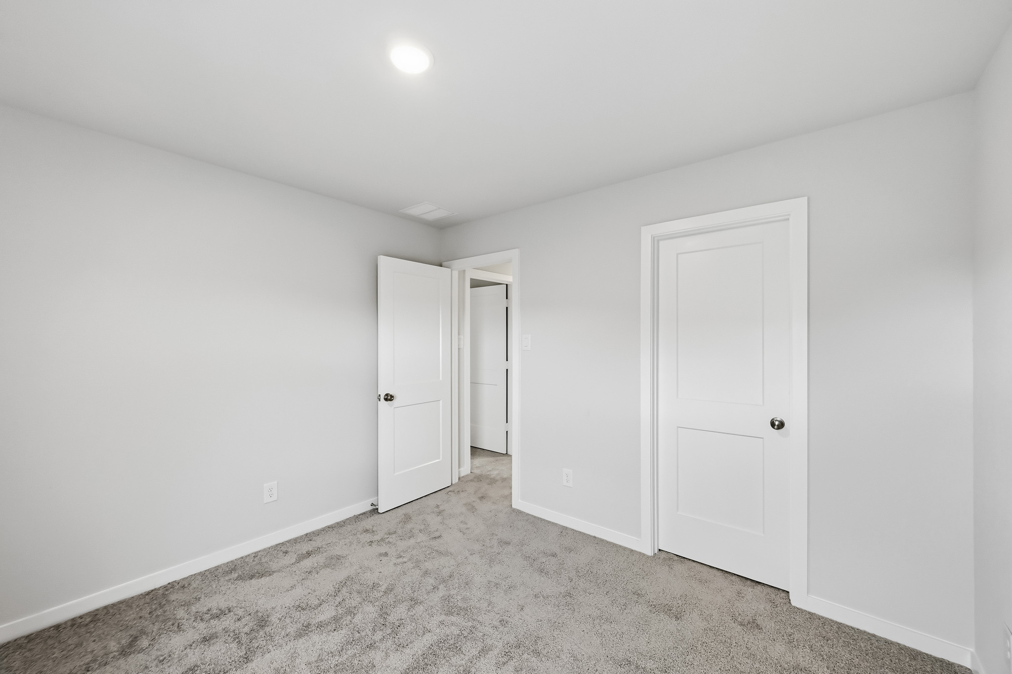 A room with white doors.