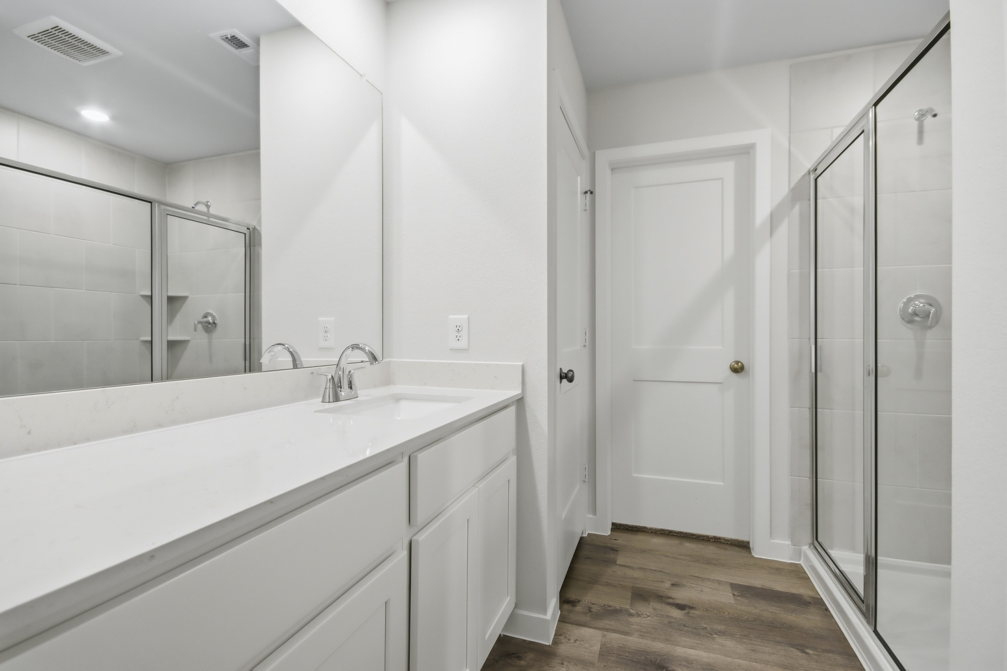 A bathroom with a tub and shower.