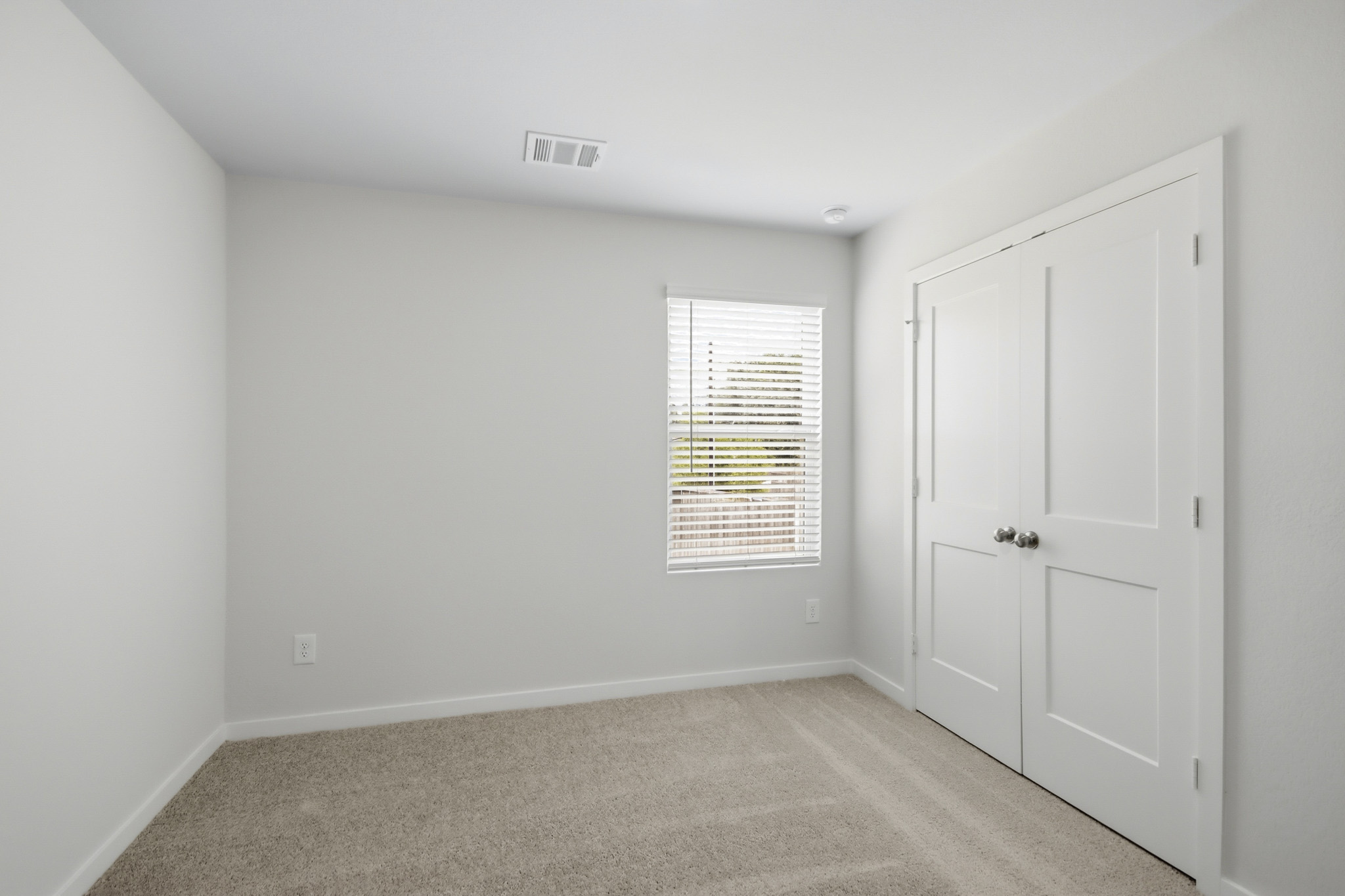 A room with white doors.