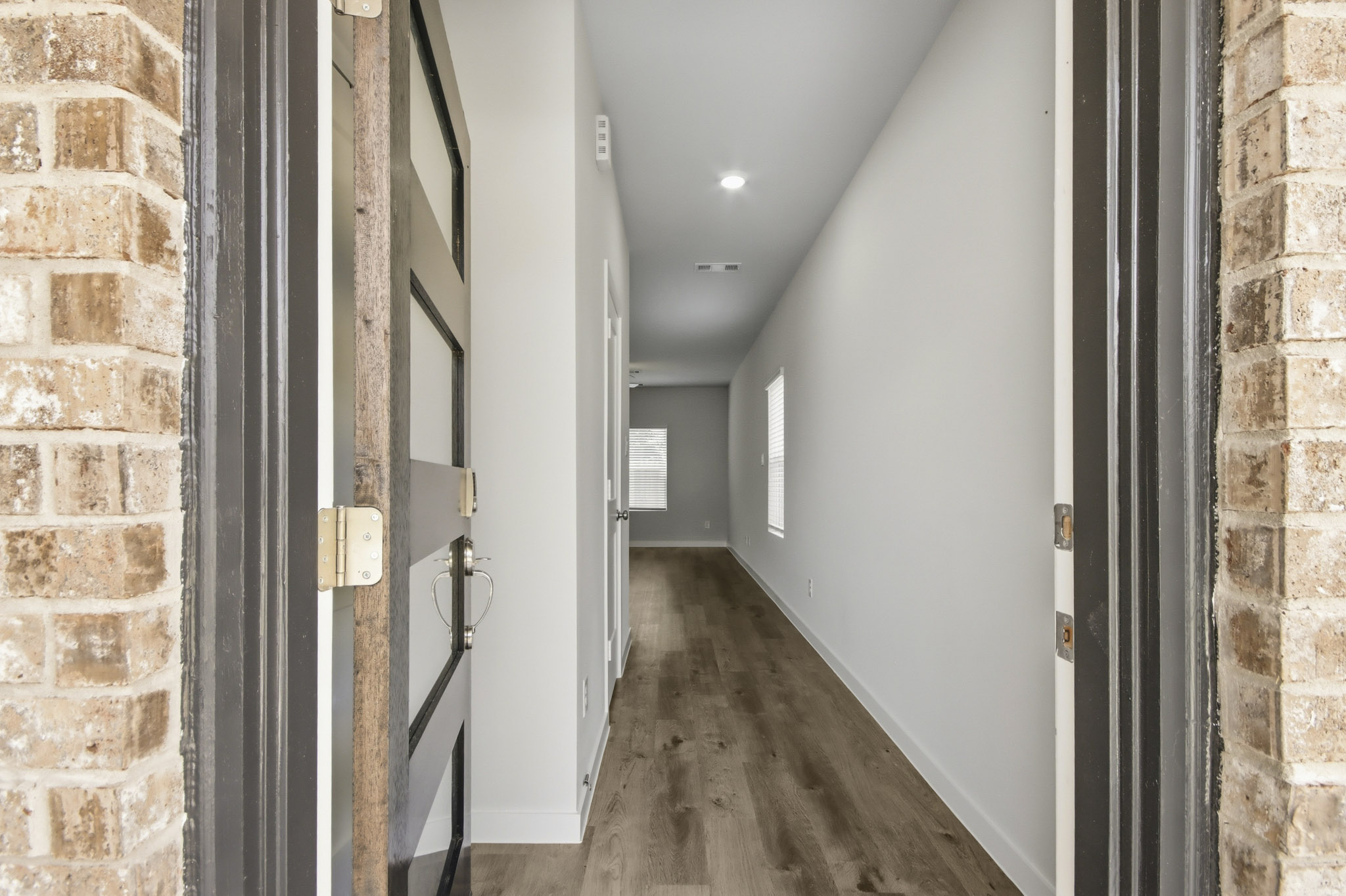 A hallway with brick walls.