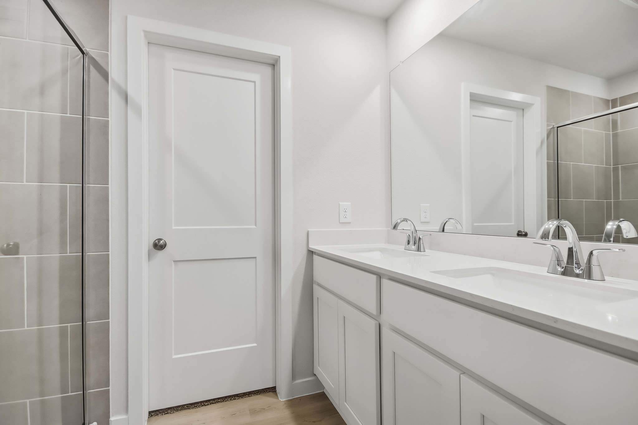 A bathroom with a glass shower.