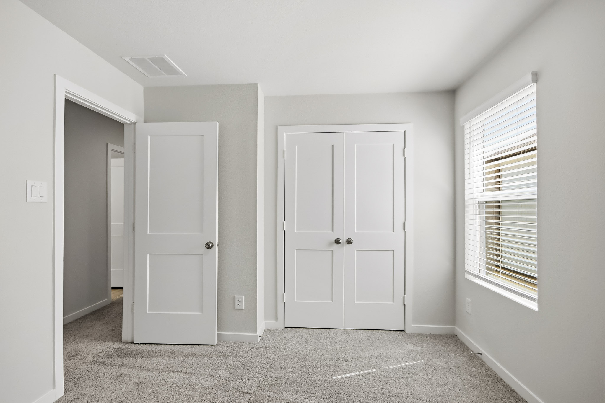 A room with white doors.