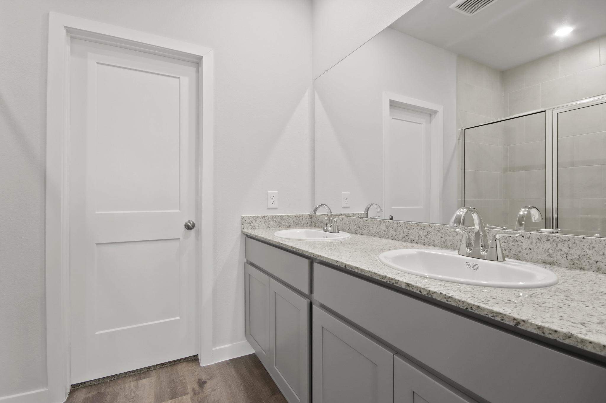 A bathroom with marble counters.
