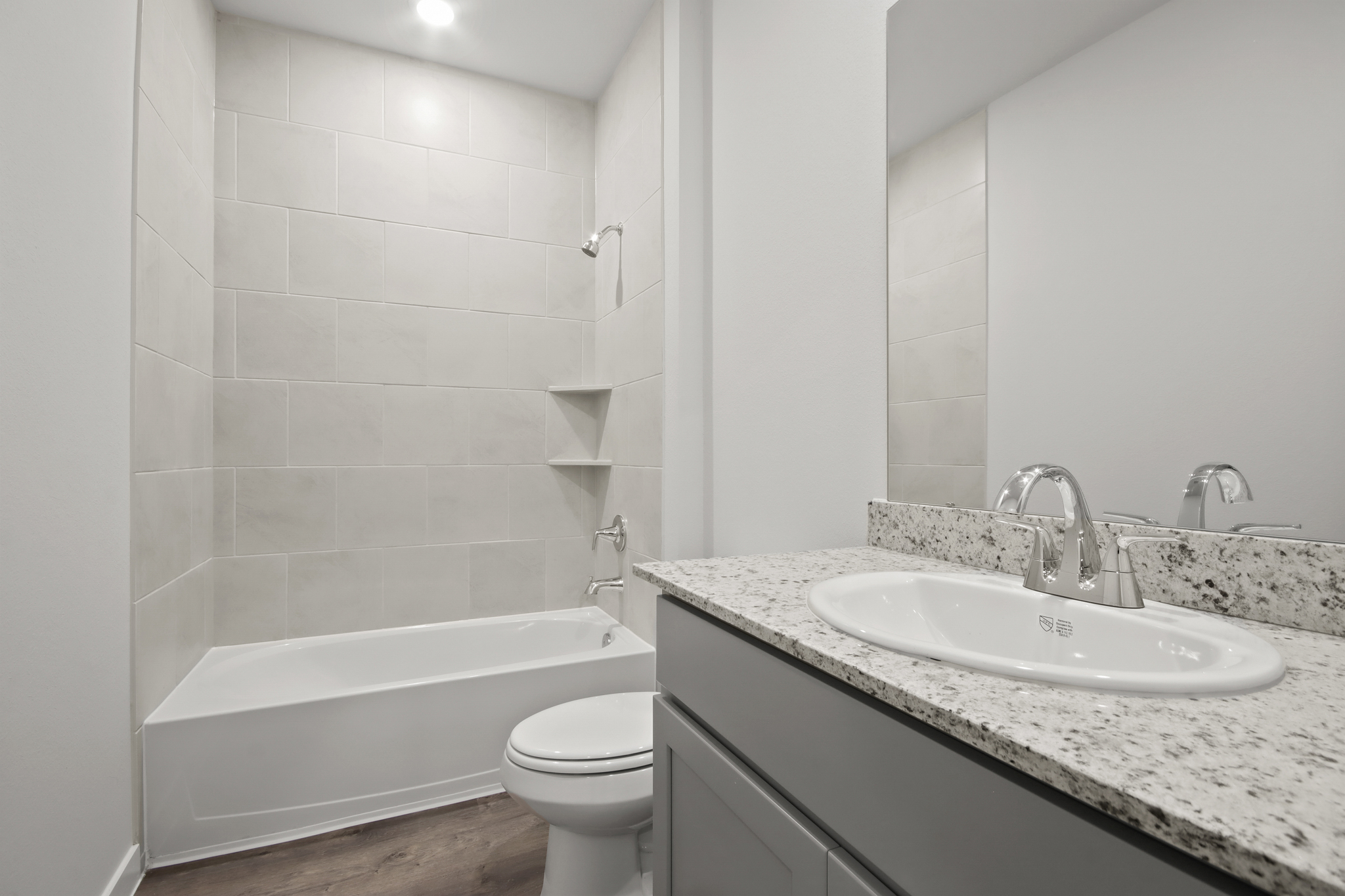 A bathroom with a sink and a toilet.