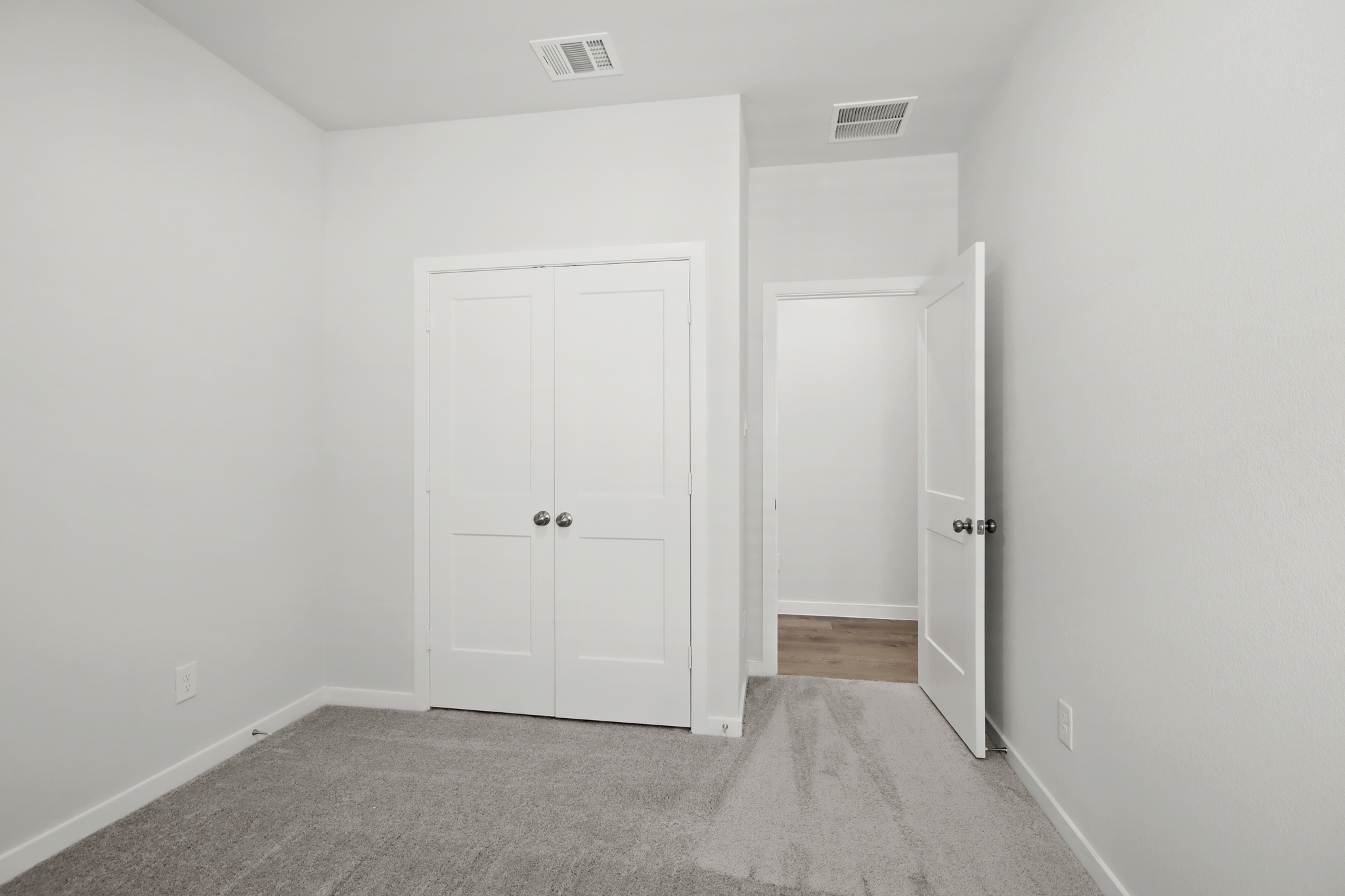 A room with white doors.