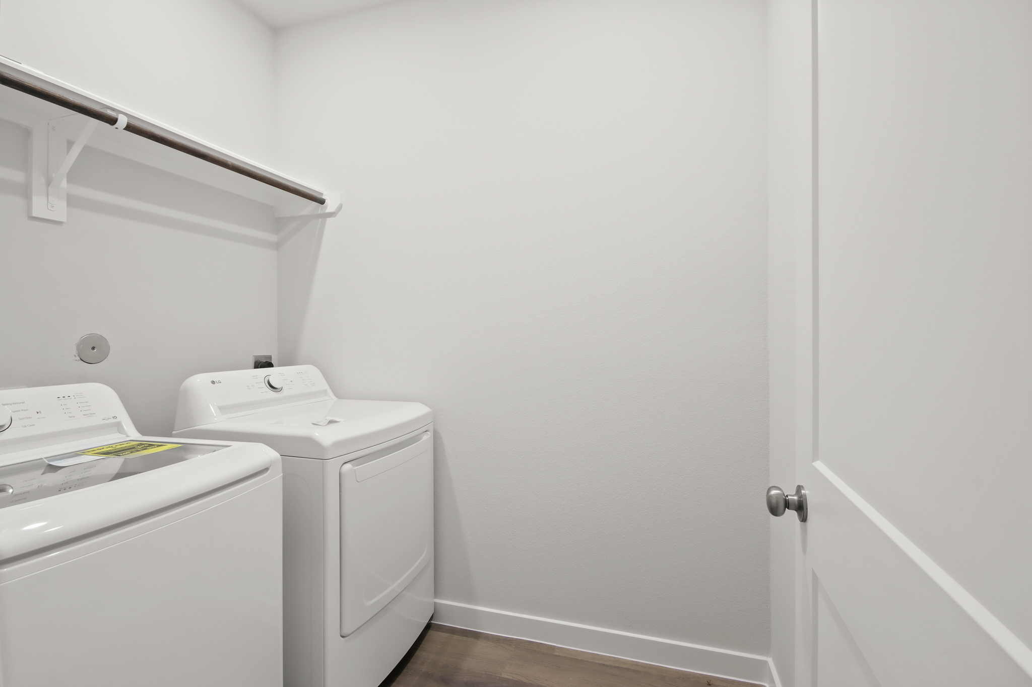 A white room with a white door and a white door.