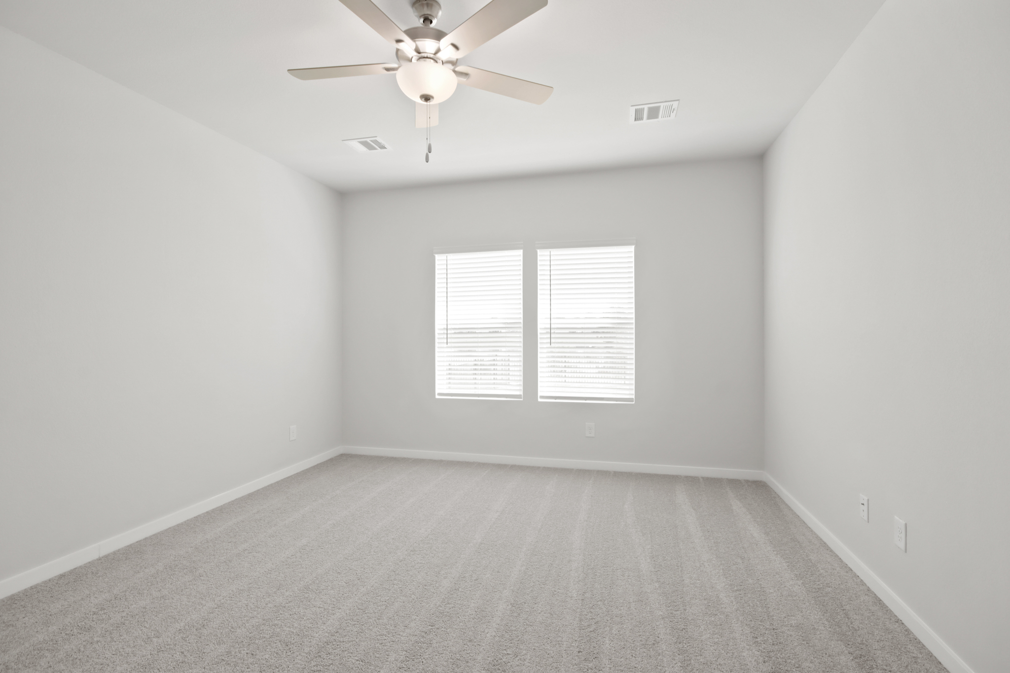 A room with a ceiling fan and a ceiling fan.