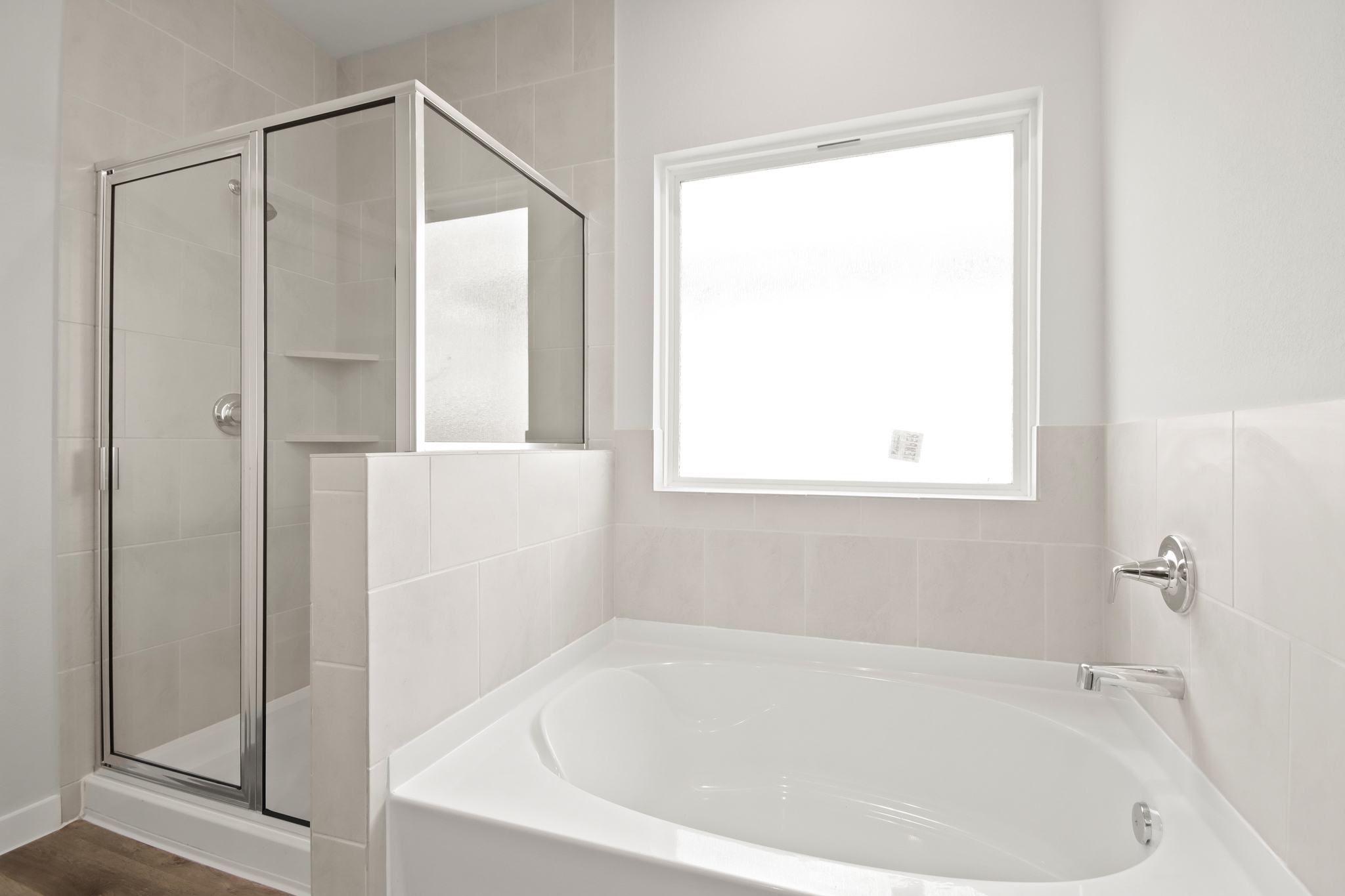 A bathtub in a bathroom.