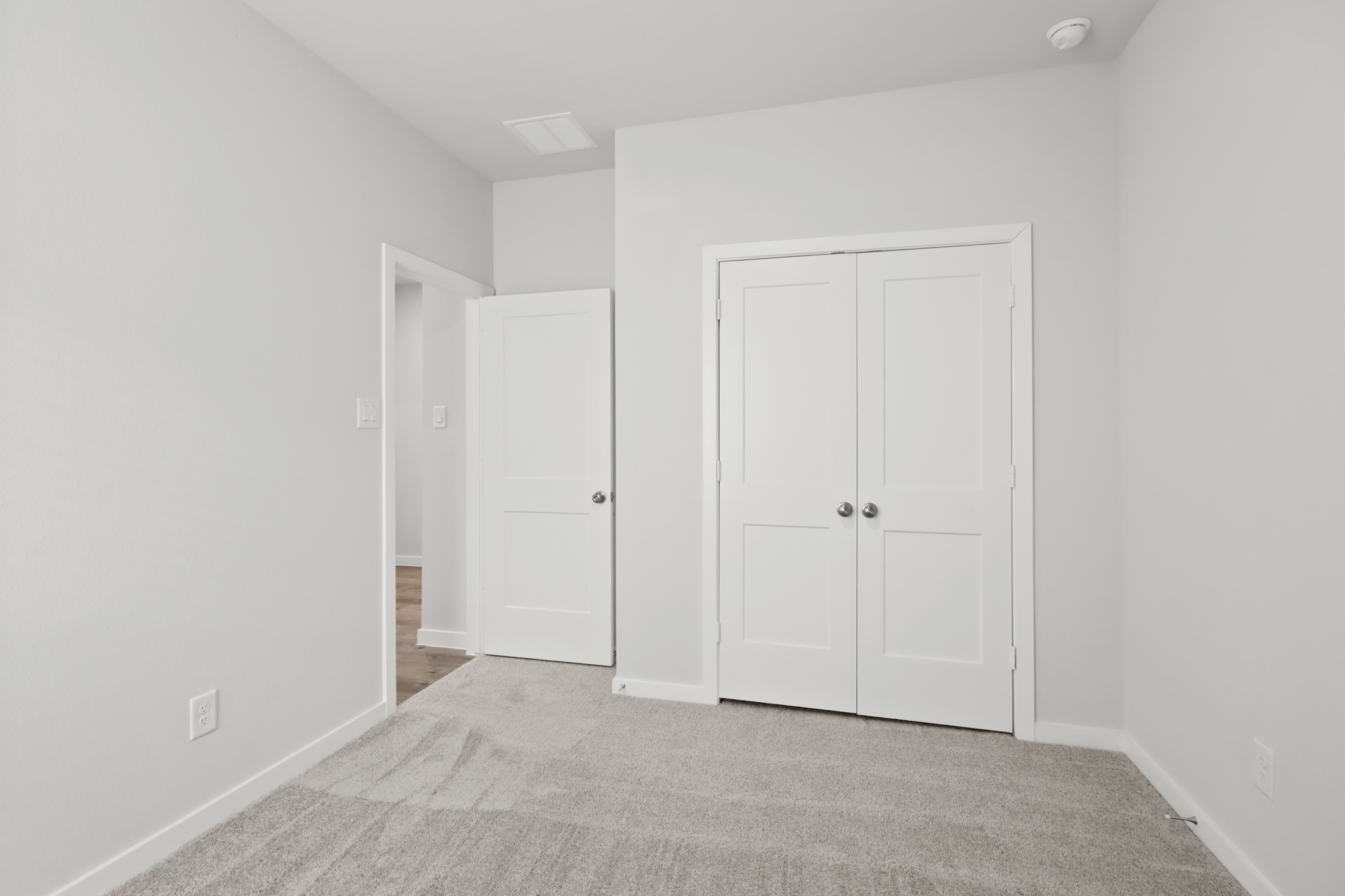 A room with white doors.