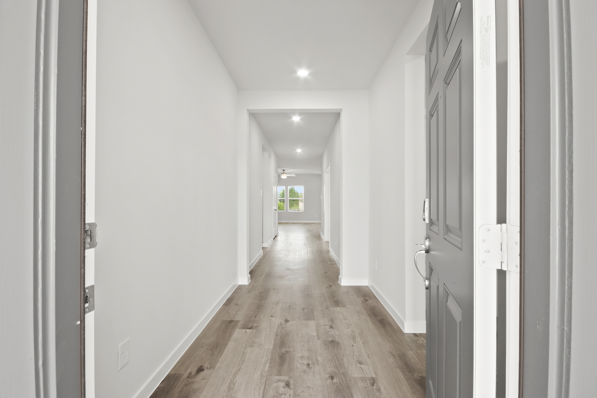 A hallway with white walls.