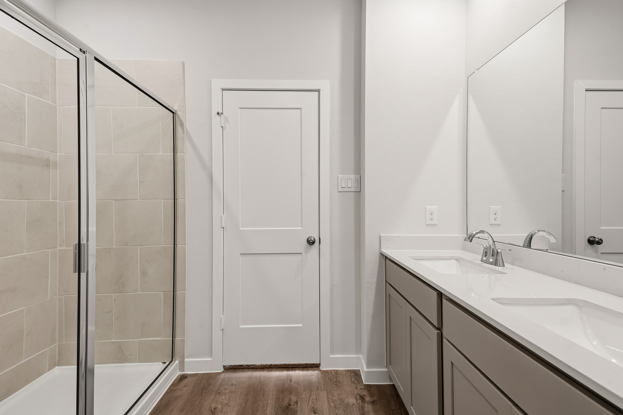 A bathroom with a glass shower.