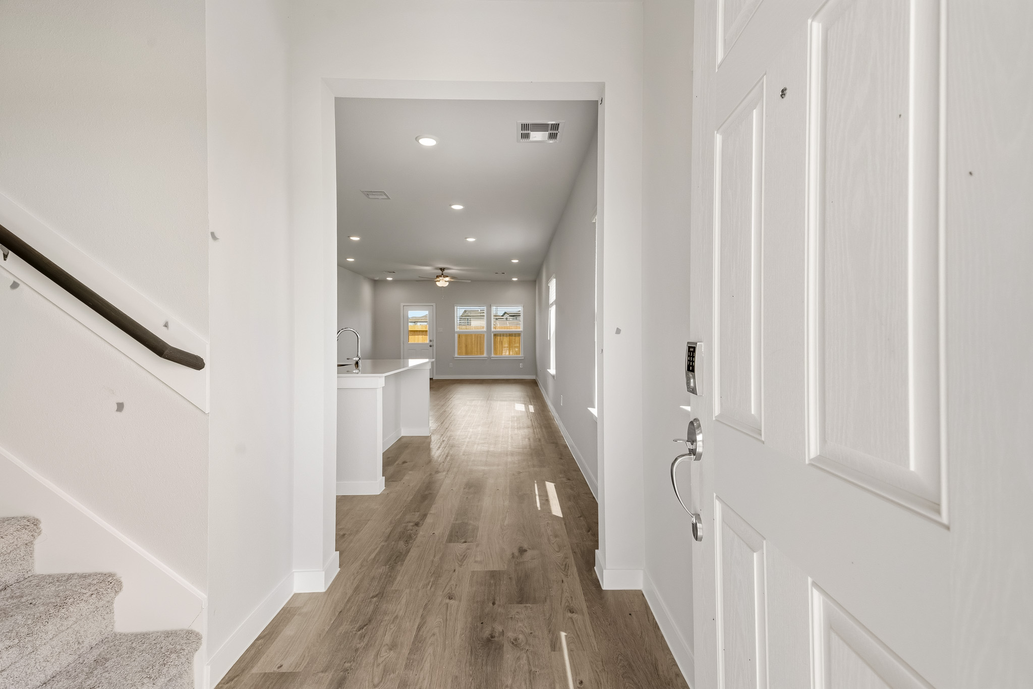 A hallway with white doors.