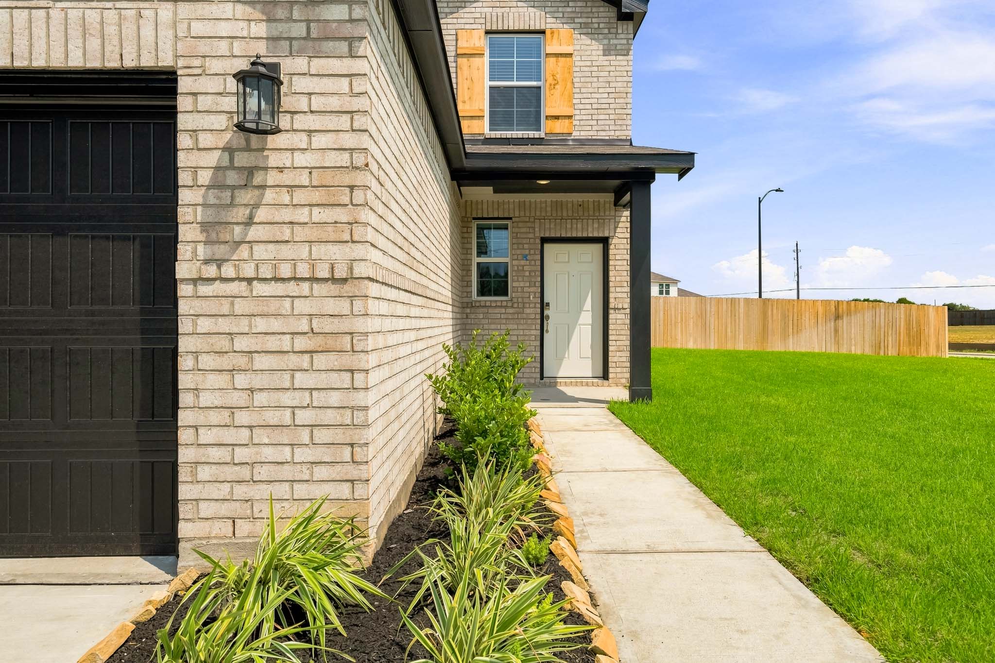 A building with a grass lawn.