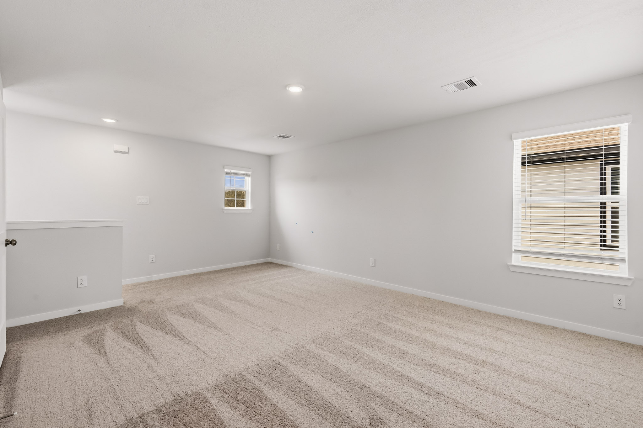 A room with a window and a door.
