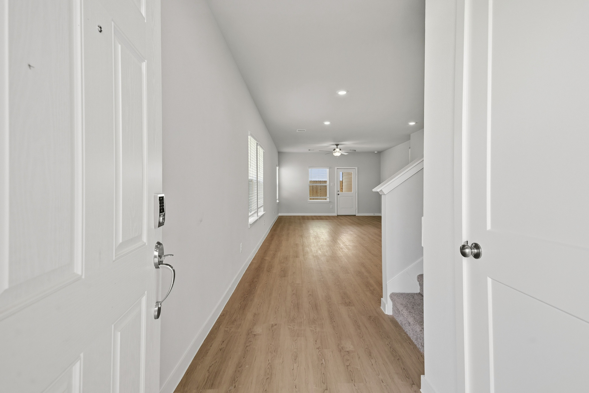 A hallway with white doors.