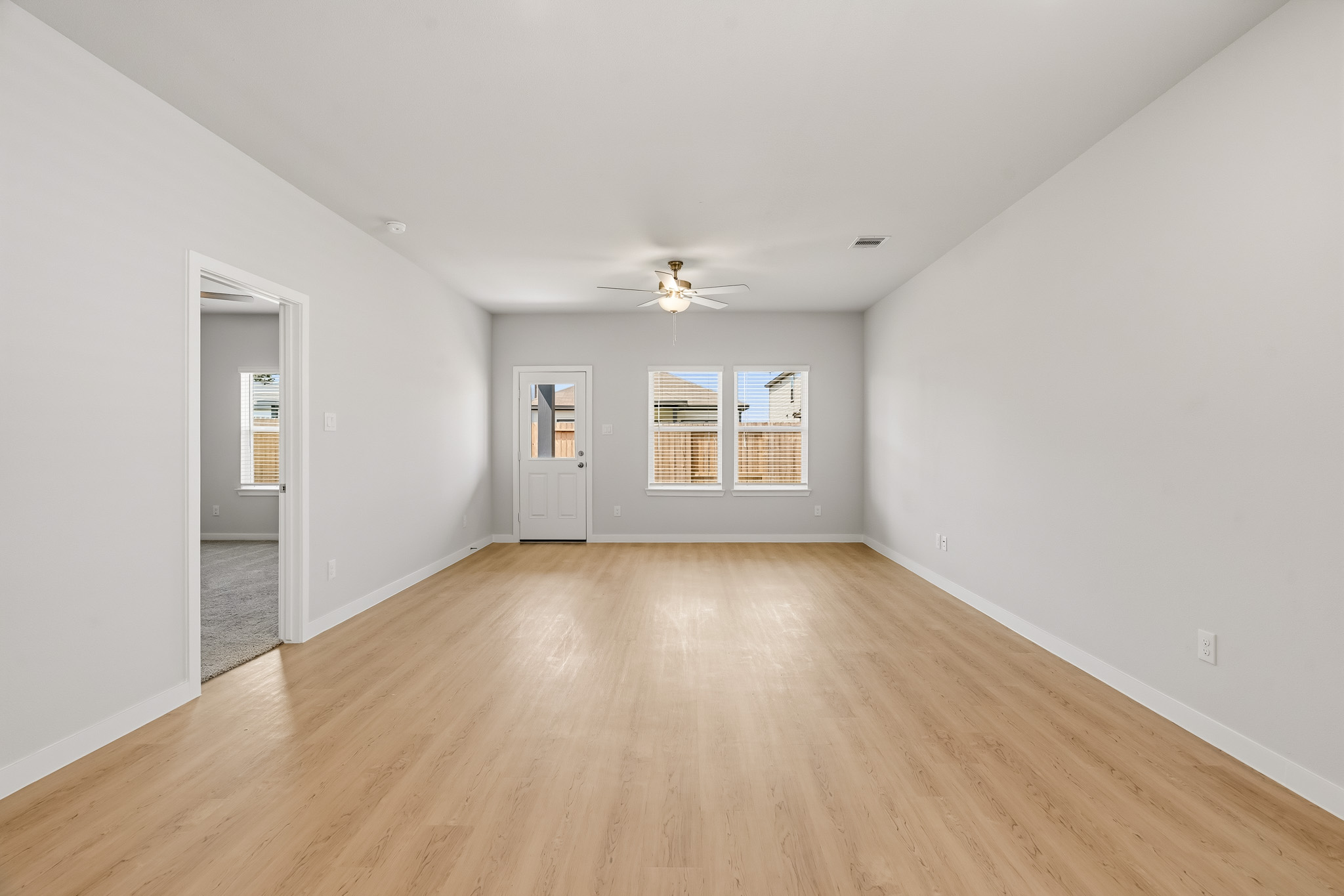 A room with a wood floor and a wood floor.