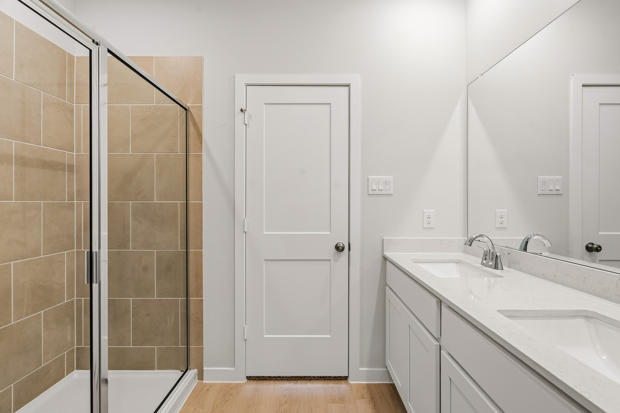 A bathroom with a glass shower.