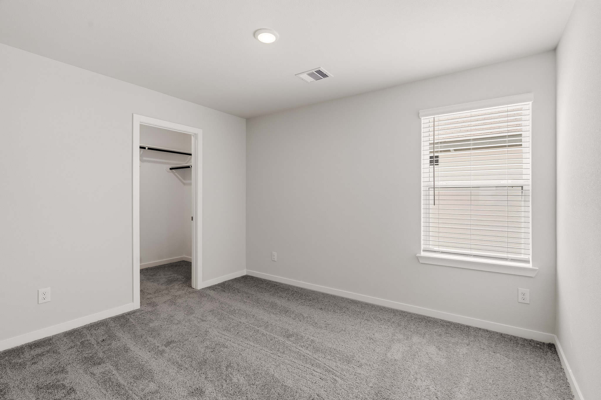 A room with a door and a window.
