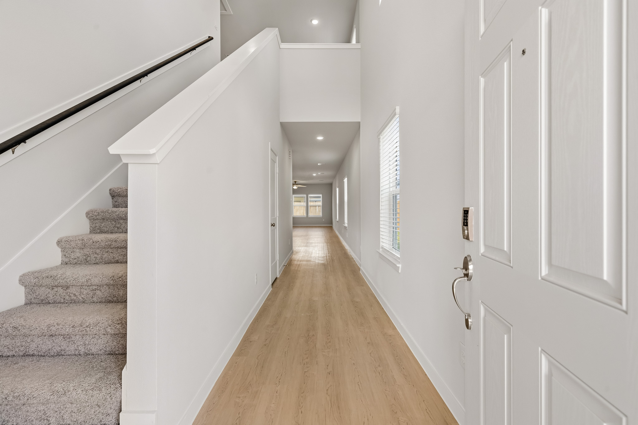 A hallway with white doors.