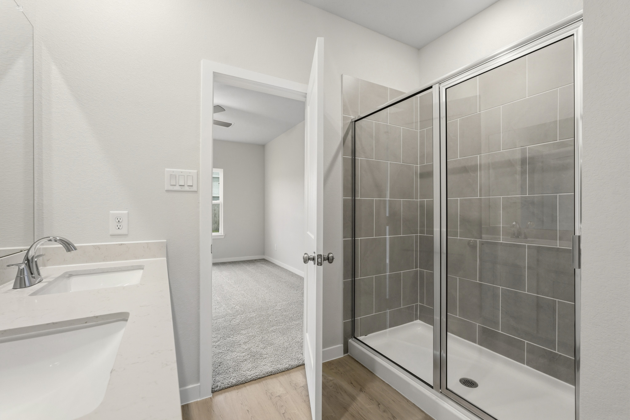 A bathroom with a glass shower.