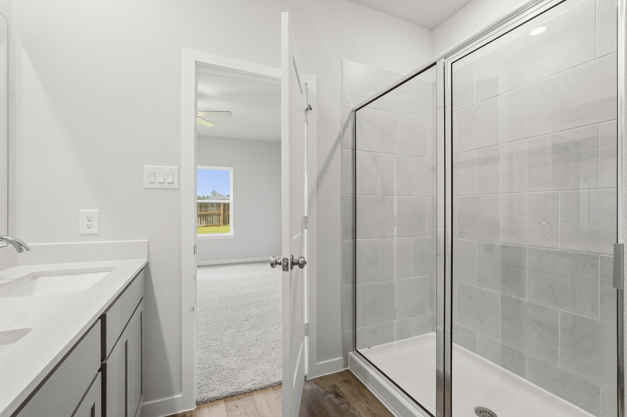 A bathroom with a glass shower.