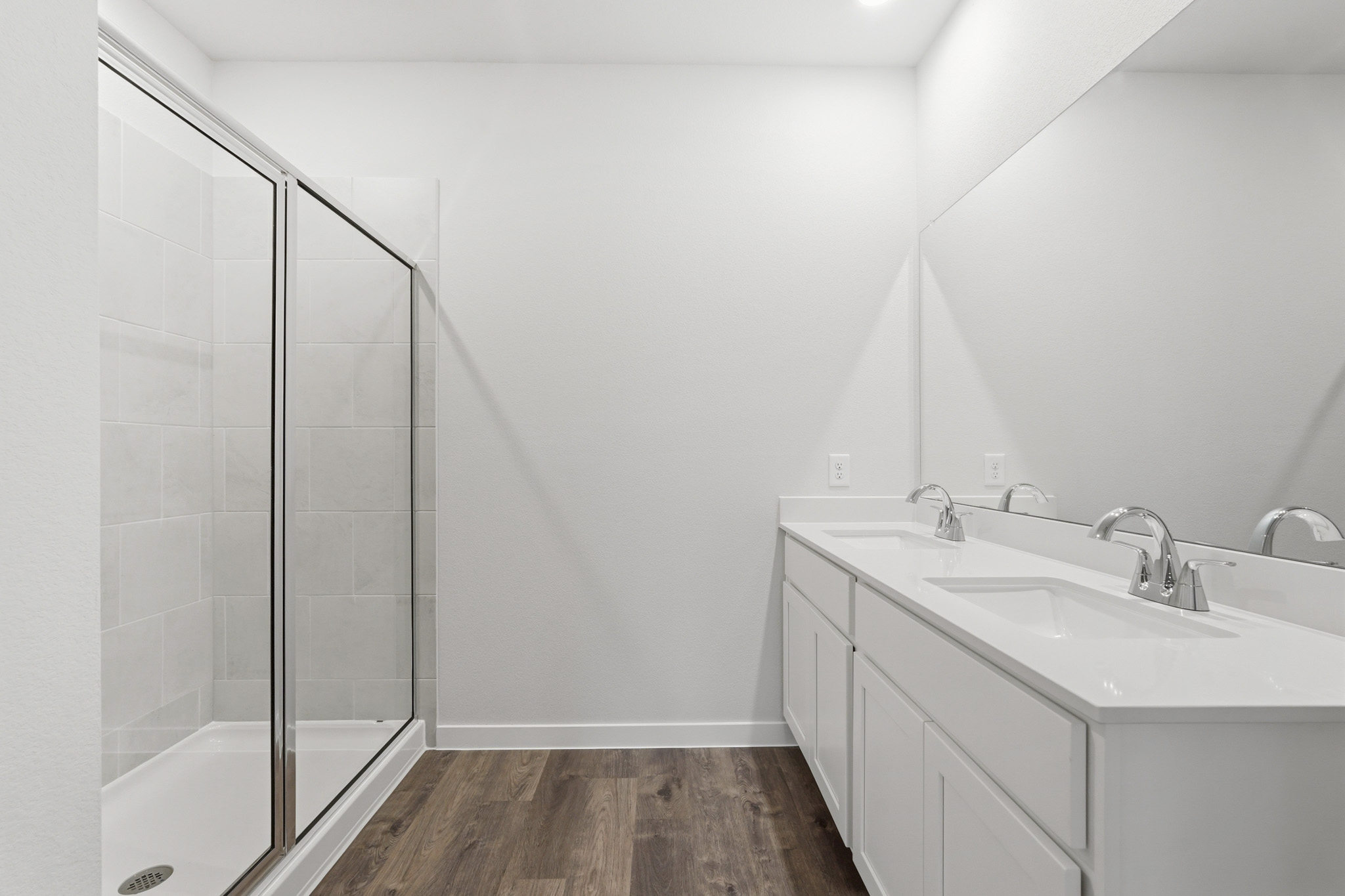 A bathroom with a glass shower.