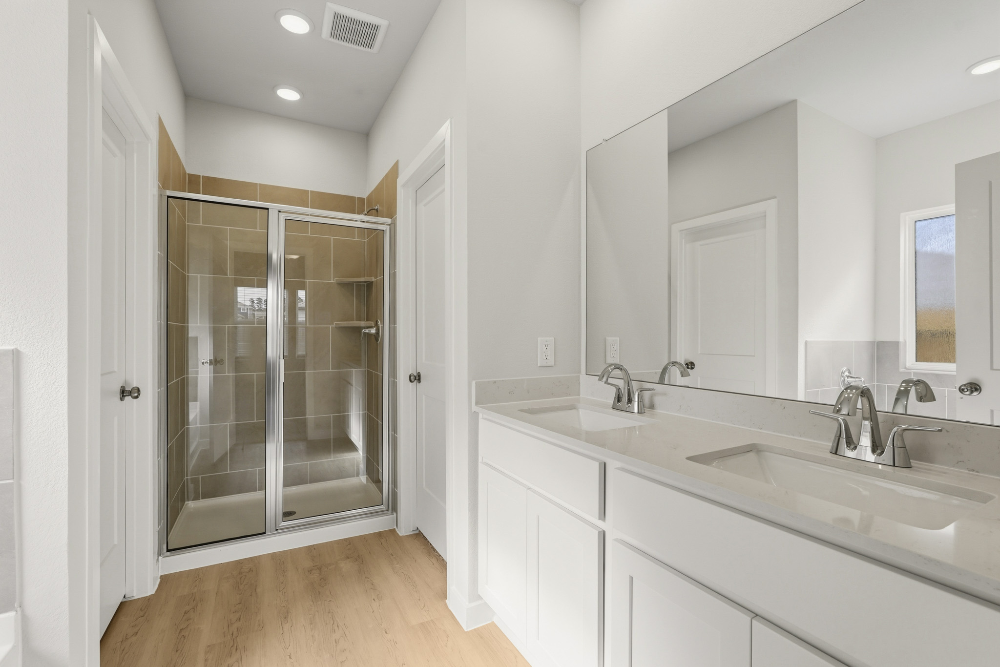 A bathroom with a glass shower.